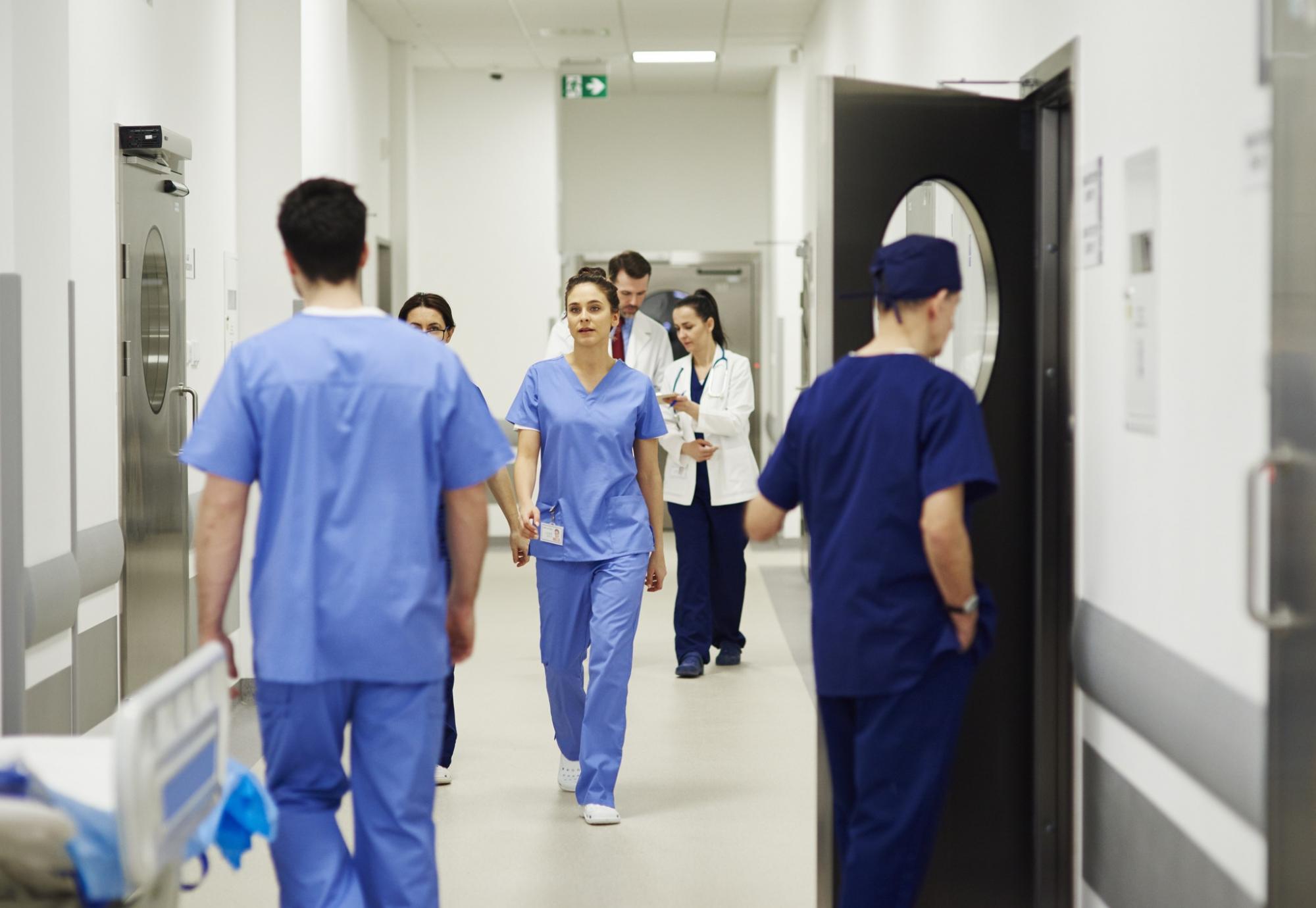 Health professionals in a busy hospital corridor