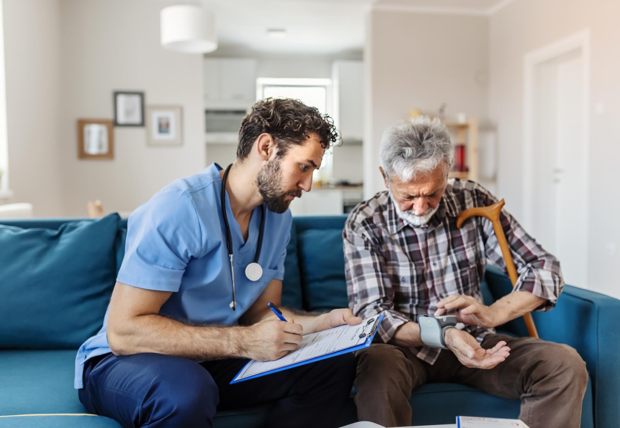 Social care worker talking to a patient