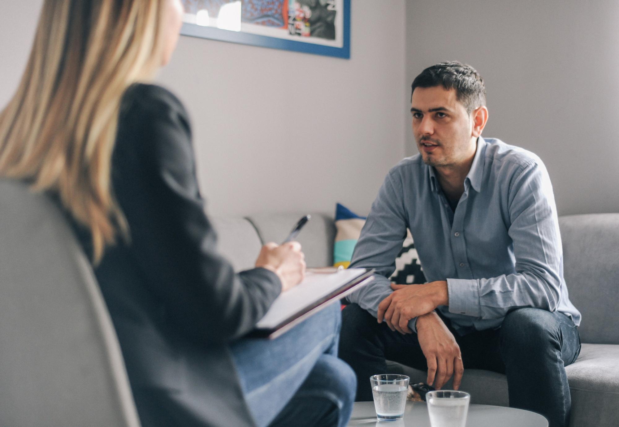 Man speaking with a therapist