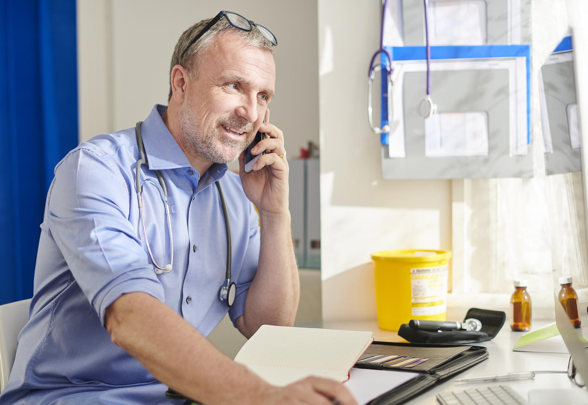 Consultant using the phone to speak with colleagues