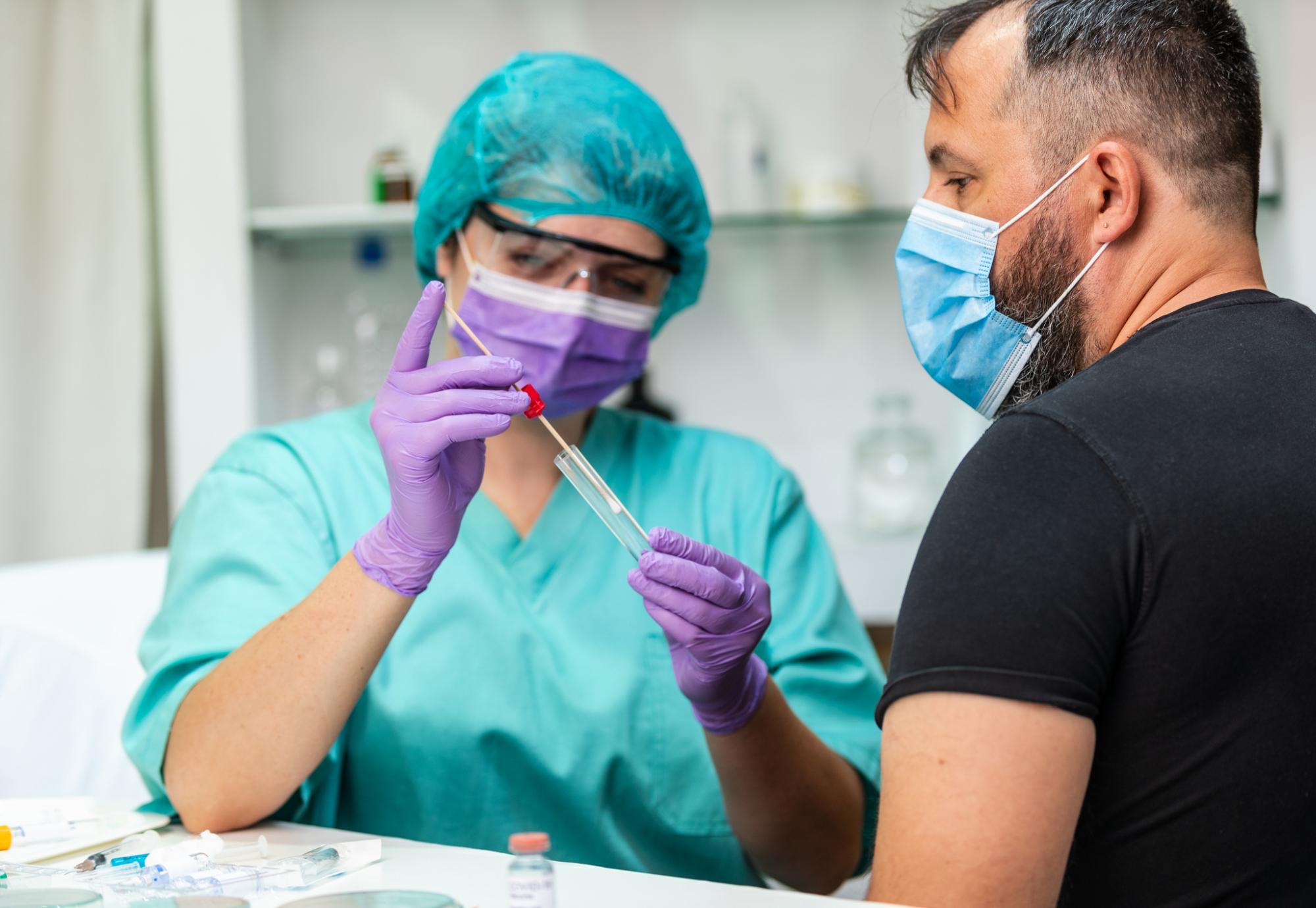 Female health professional swabbing a patient