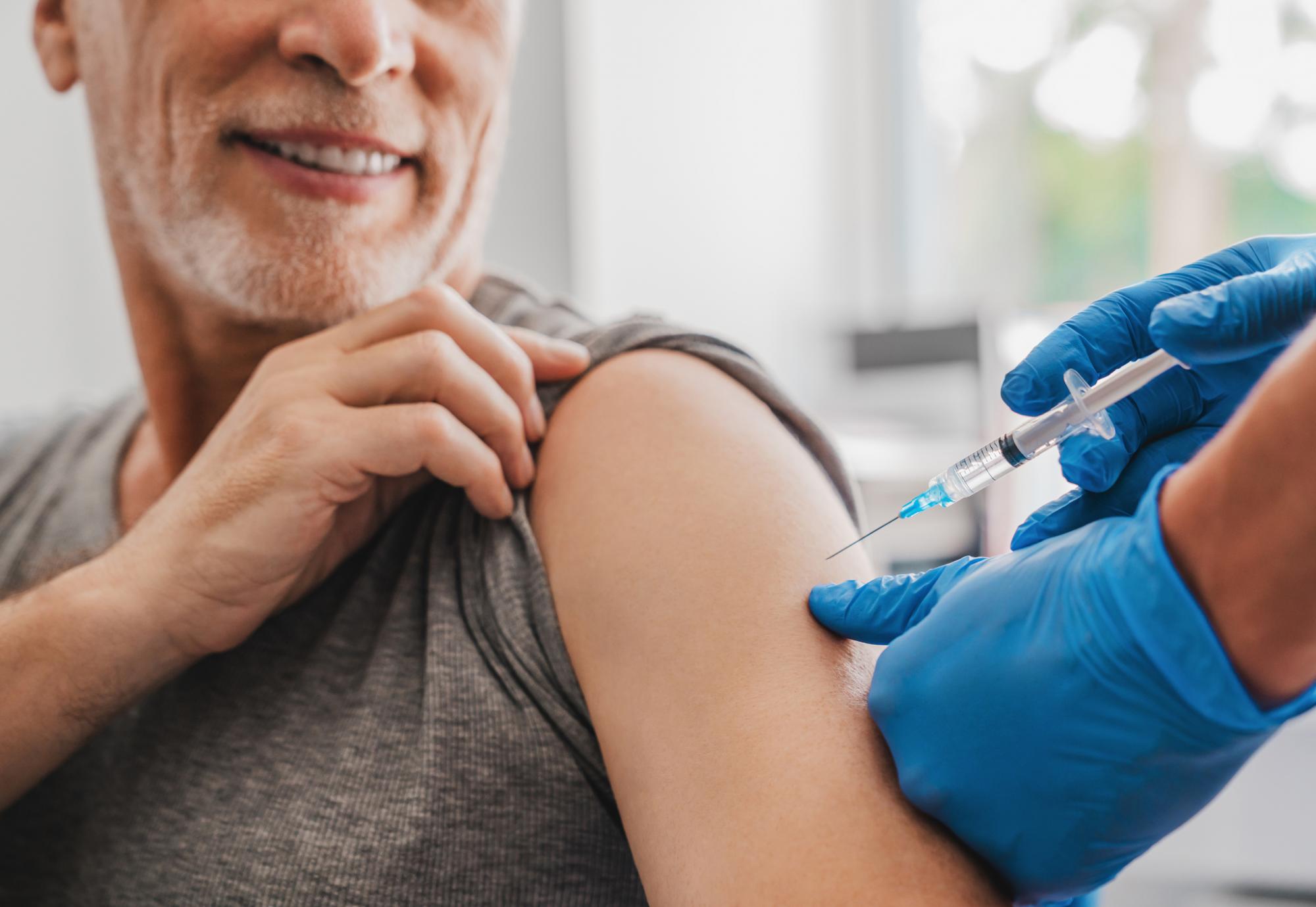 Patient receiving a vaccine jab