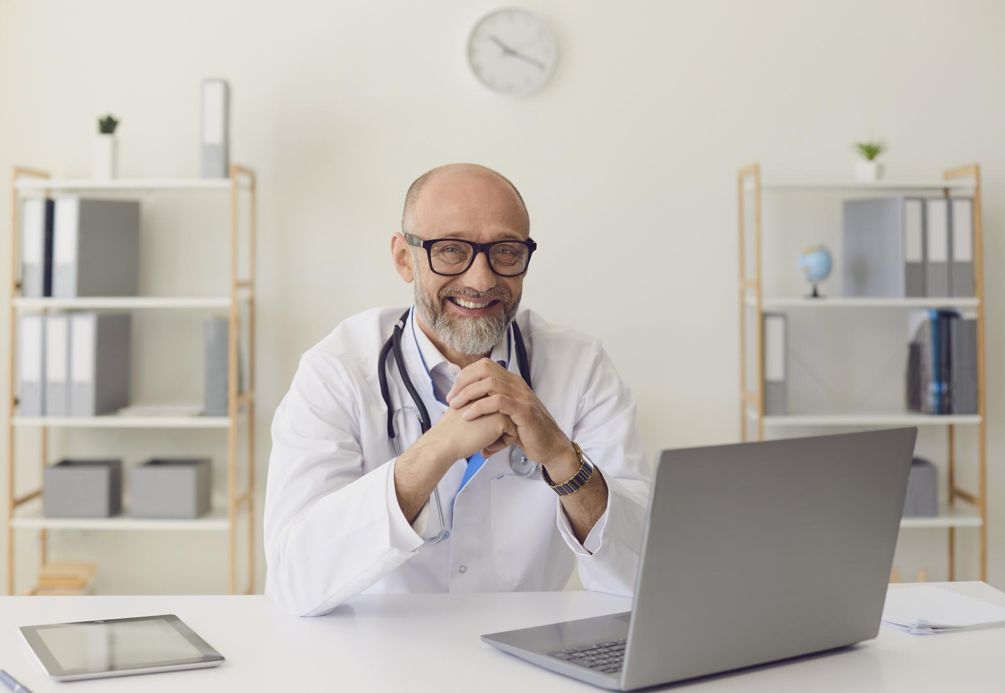 Doctor using a laptop to communicate with patients