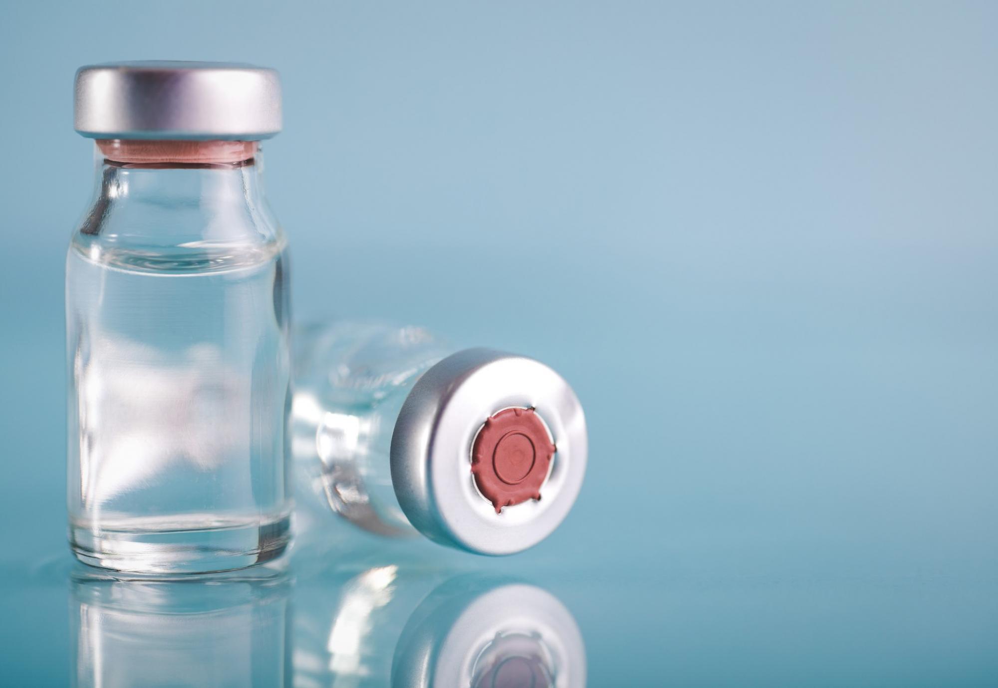 Vaccine vials against a generic background