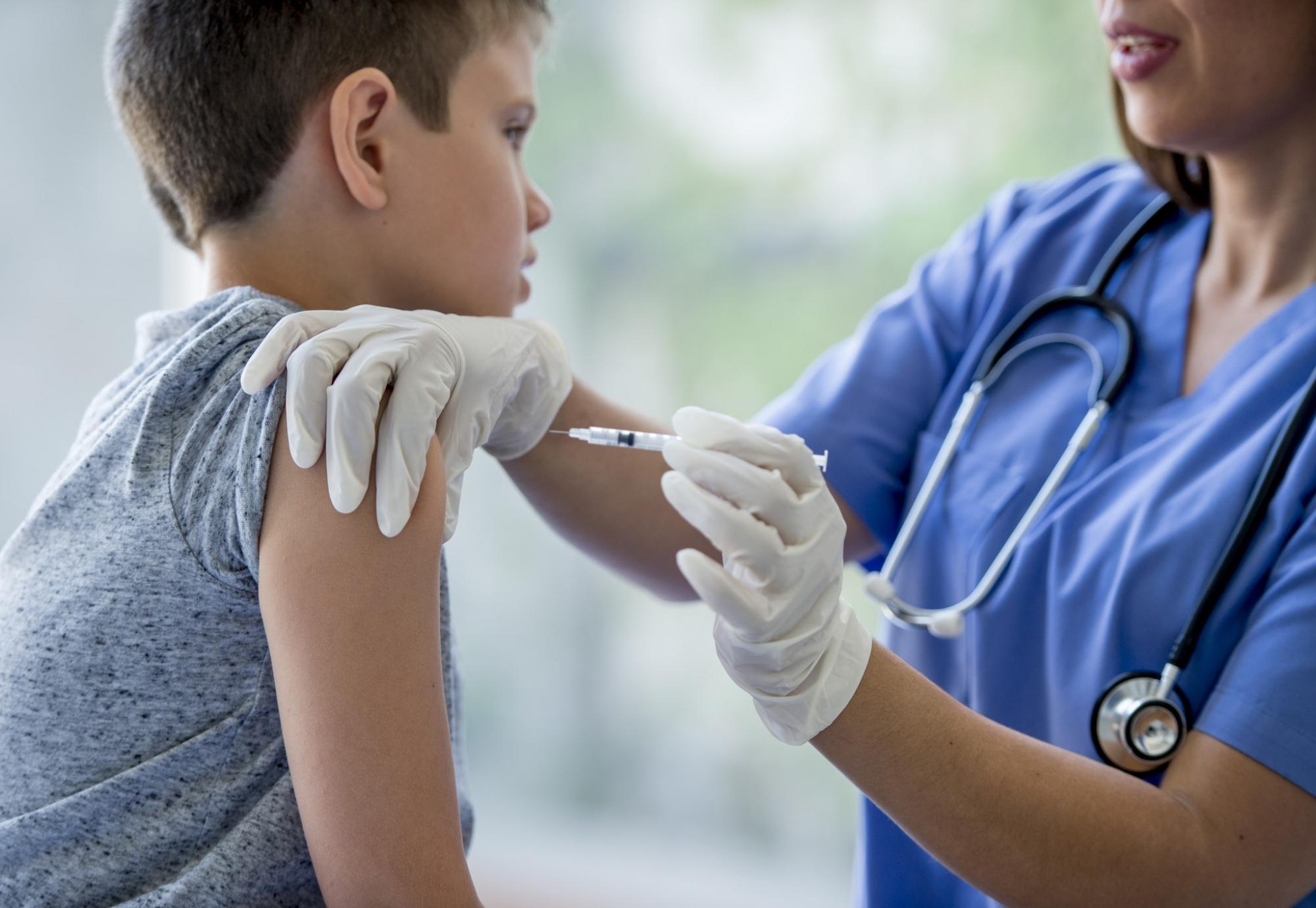 Child receiving a vaccine jab