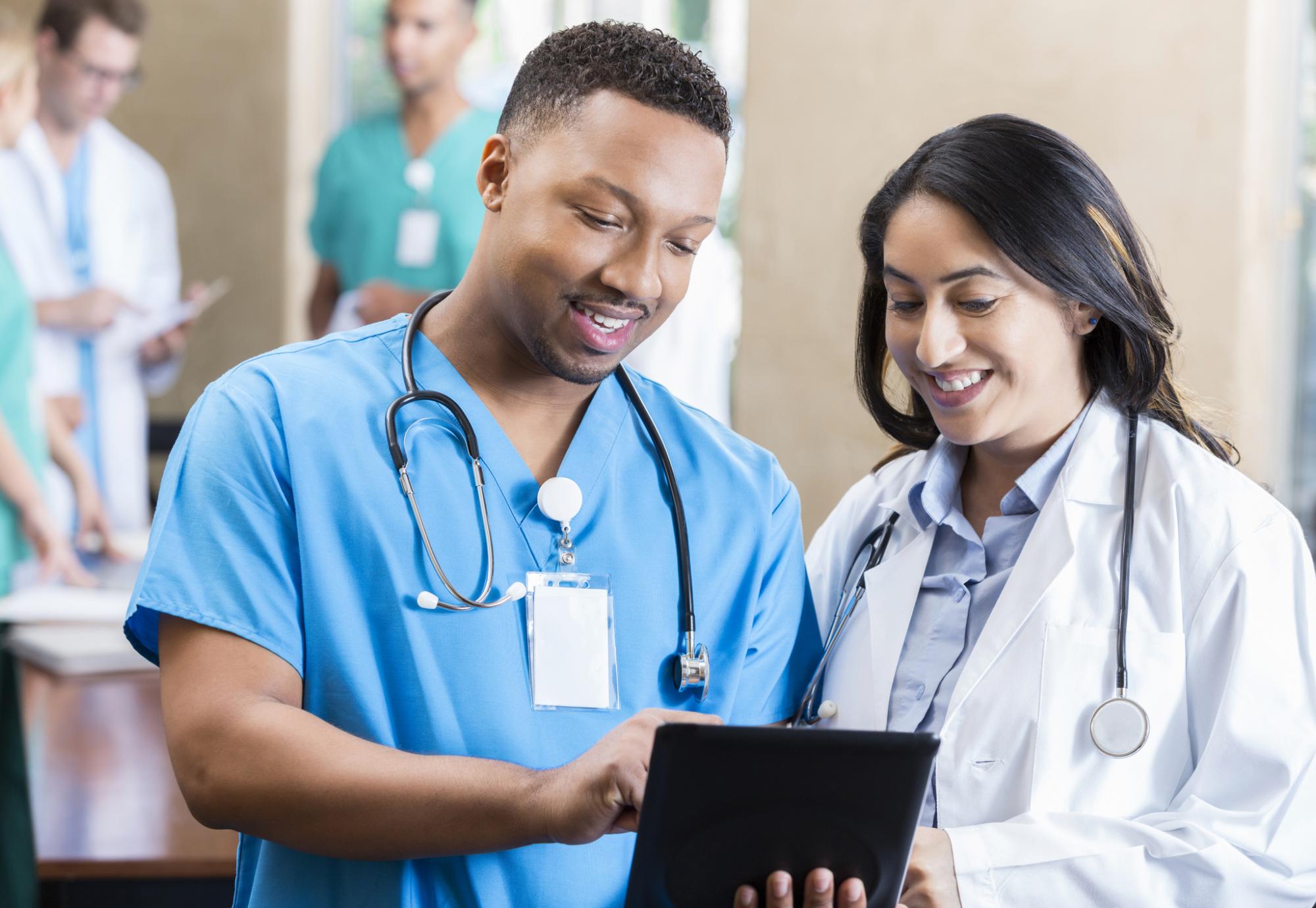 Medical professional discussing with his colleague