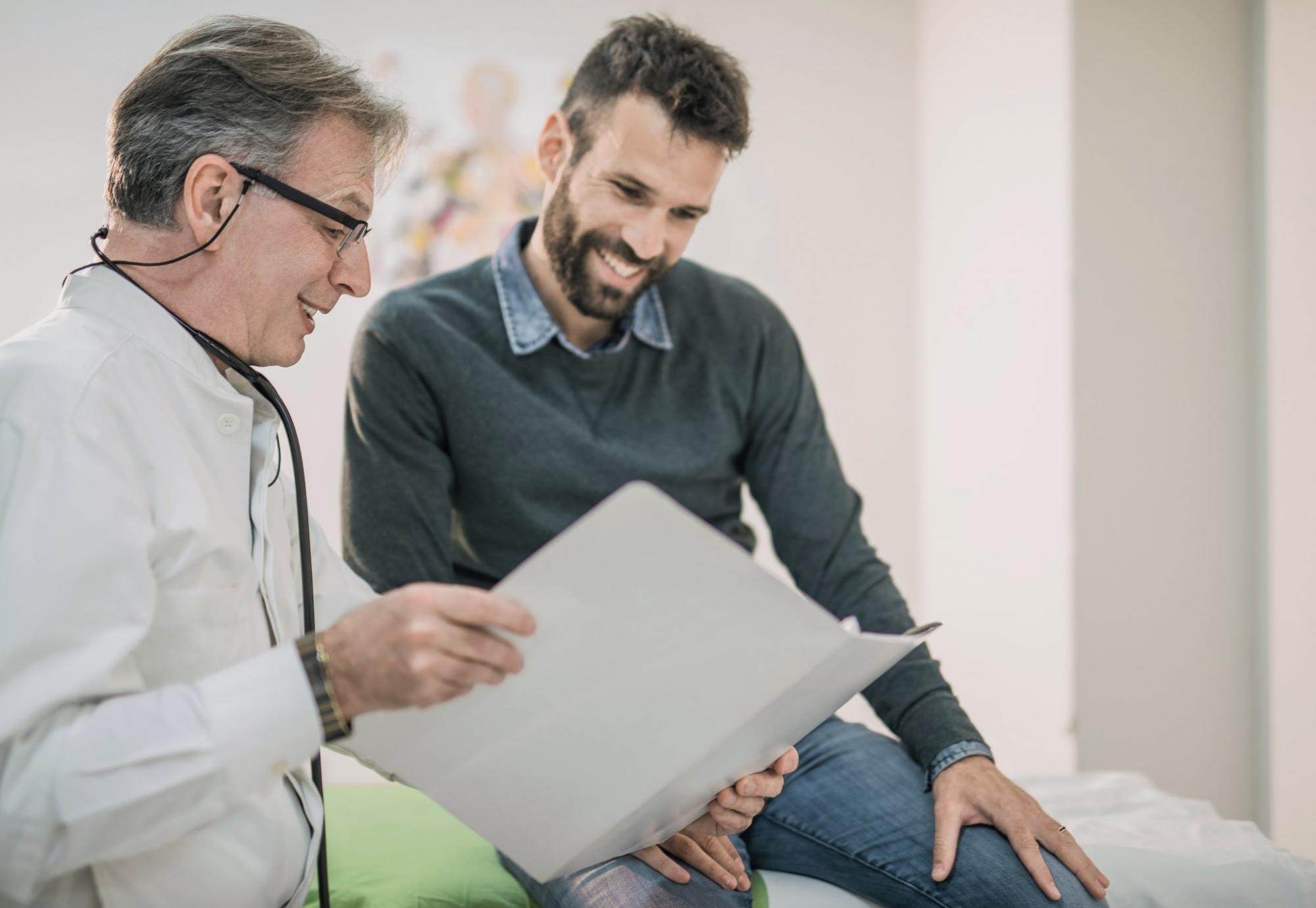 Doctor and male patient discussing his care