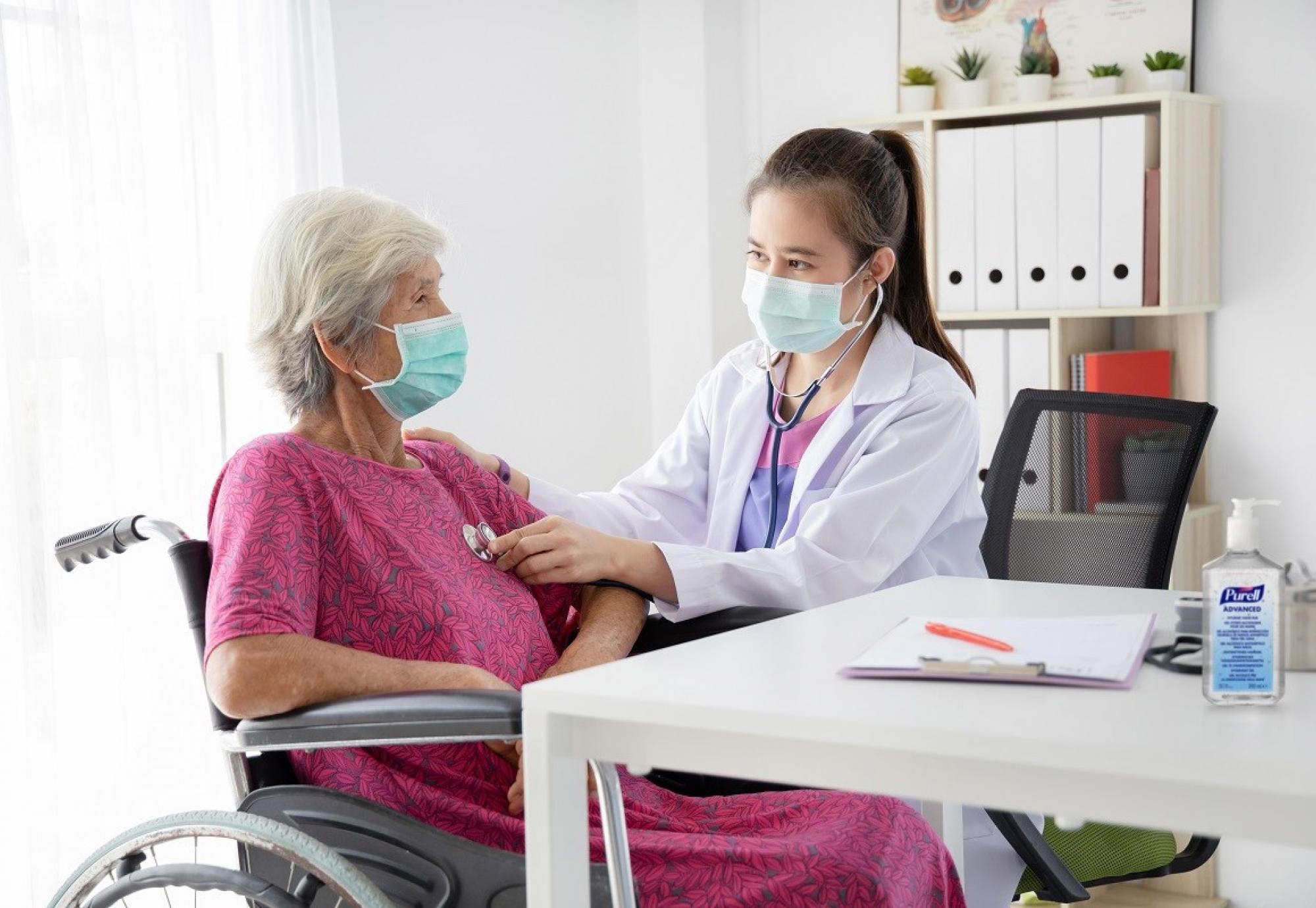 Woman receiving treatment from a healthcare professional