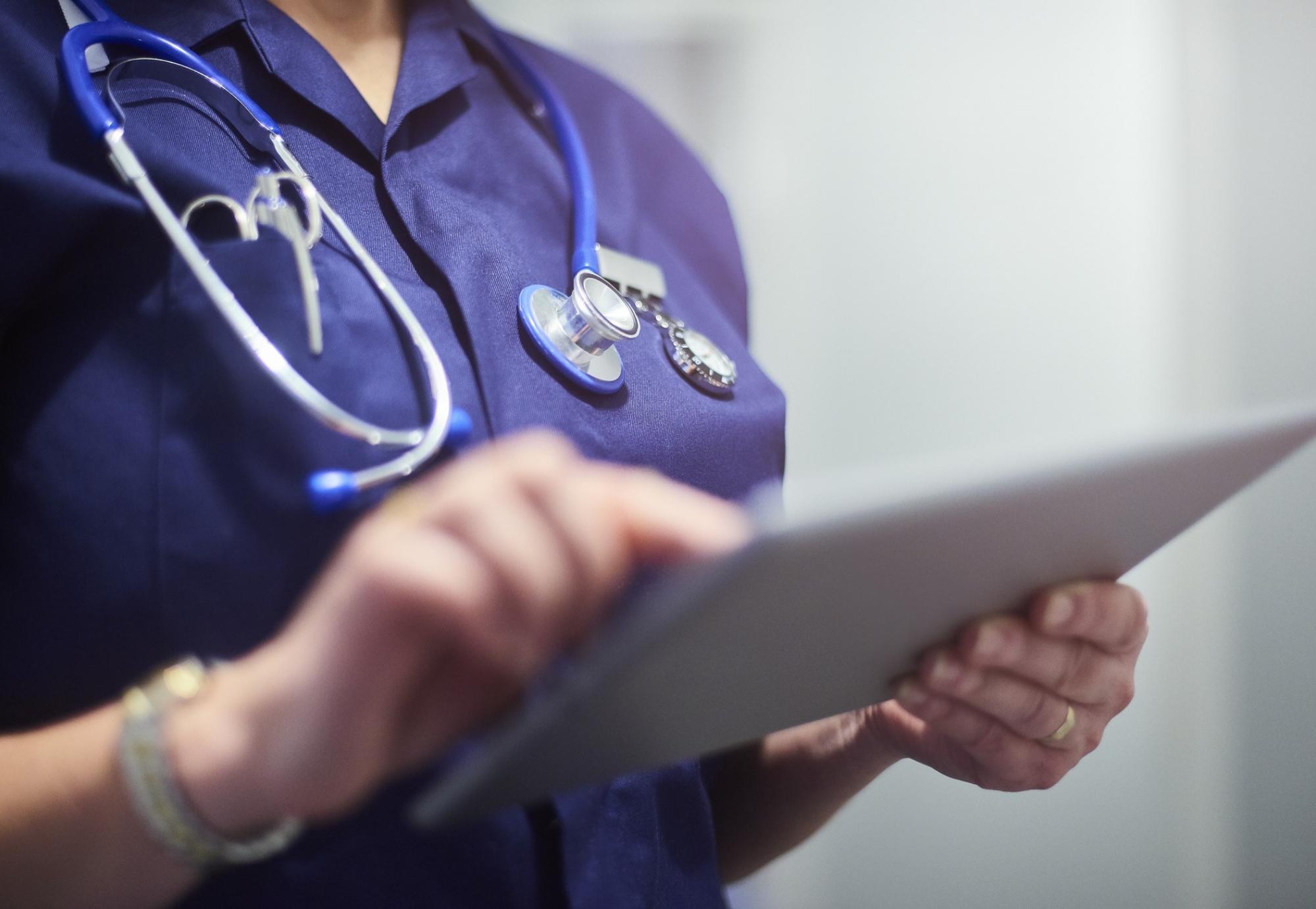 Nurse using a tablet PC