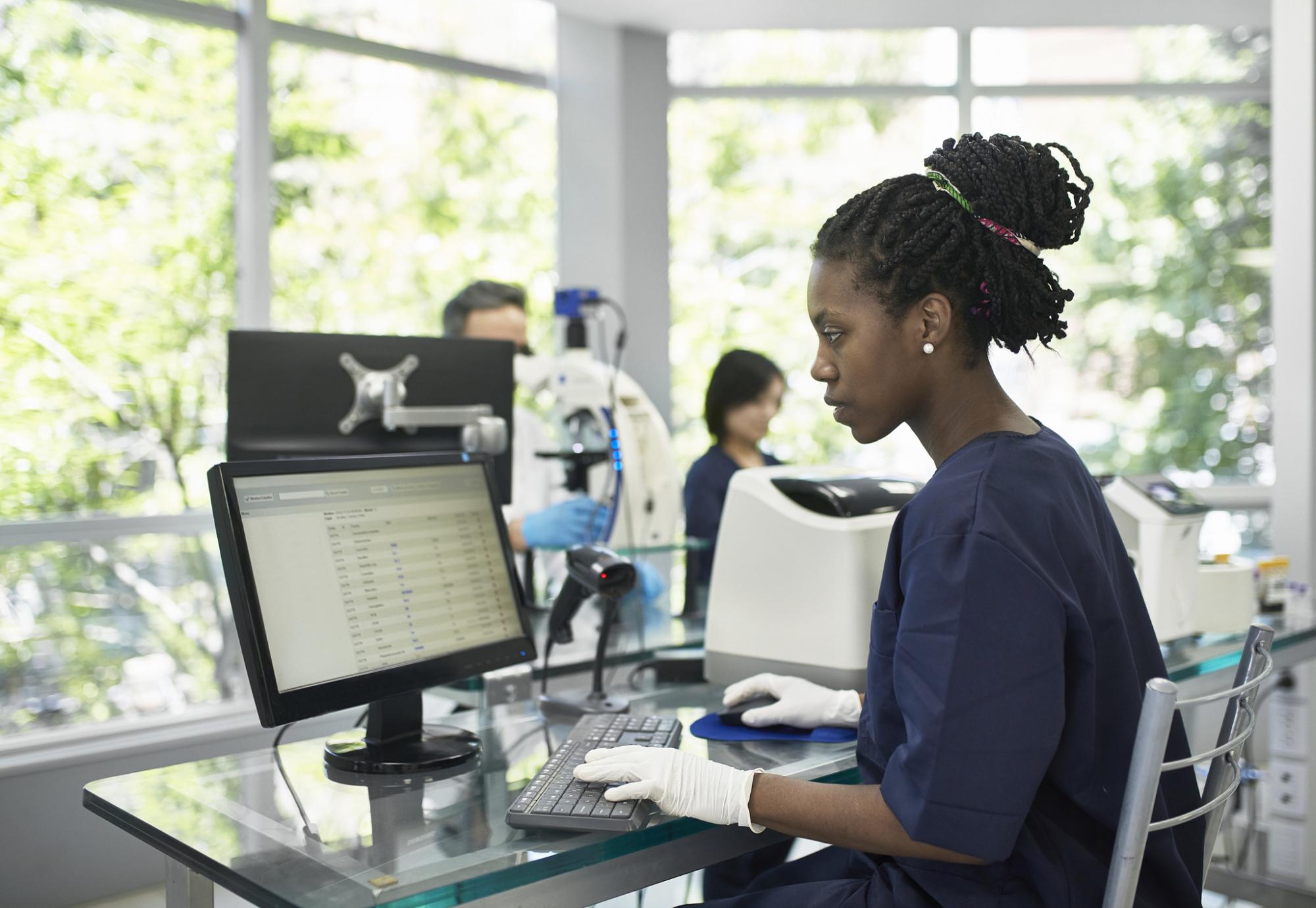 Health professional accessing data on a computer