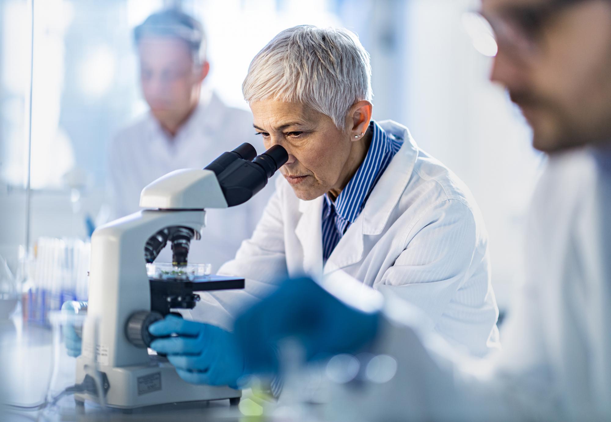 Researcher using lab equipment