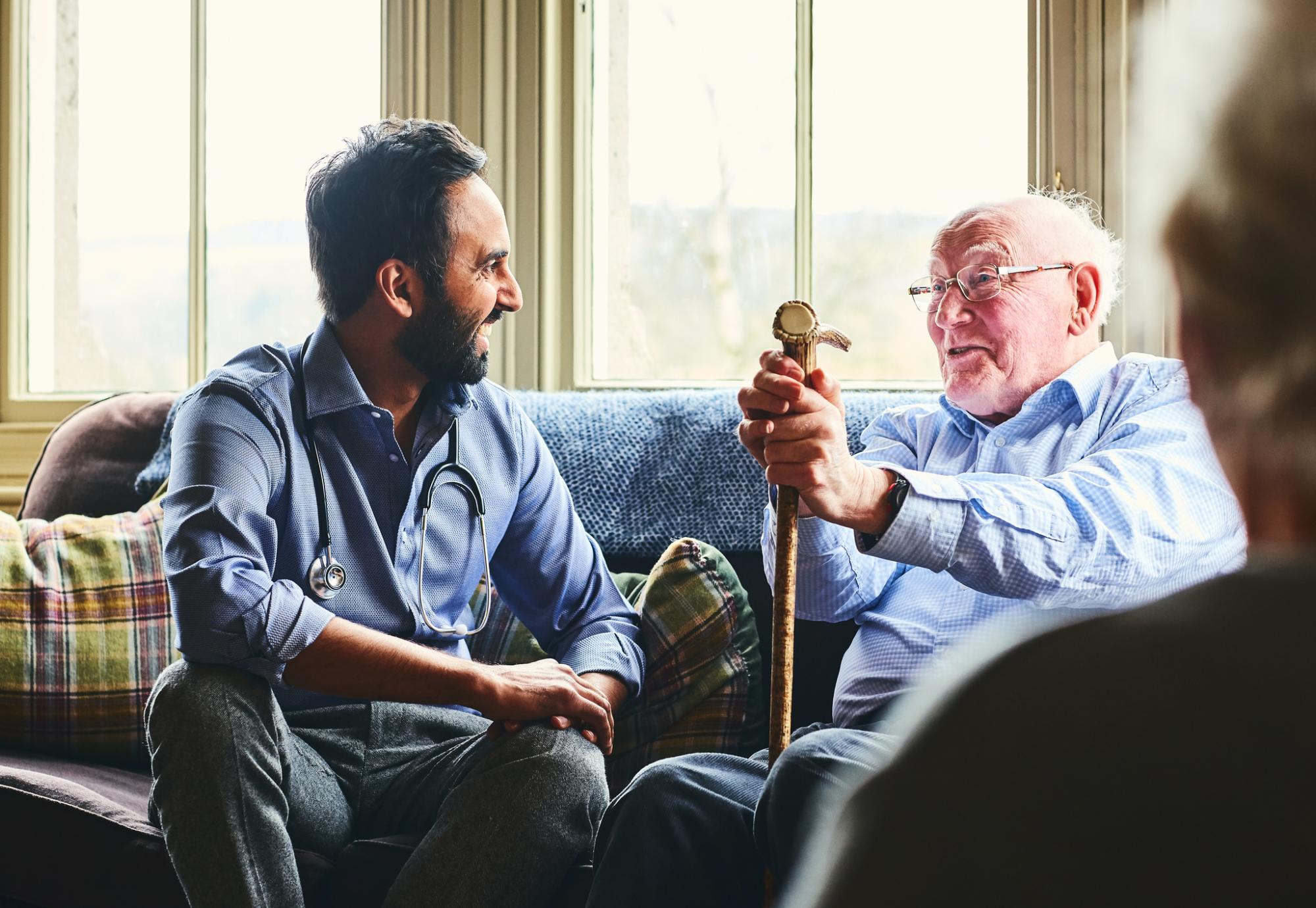 Doctor talking to an elderly care home resident