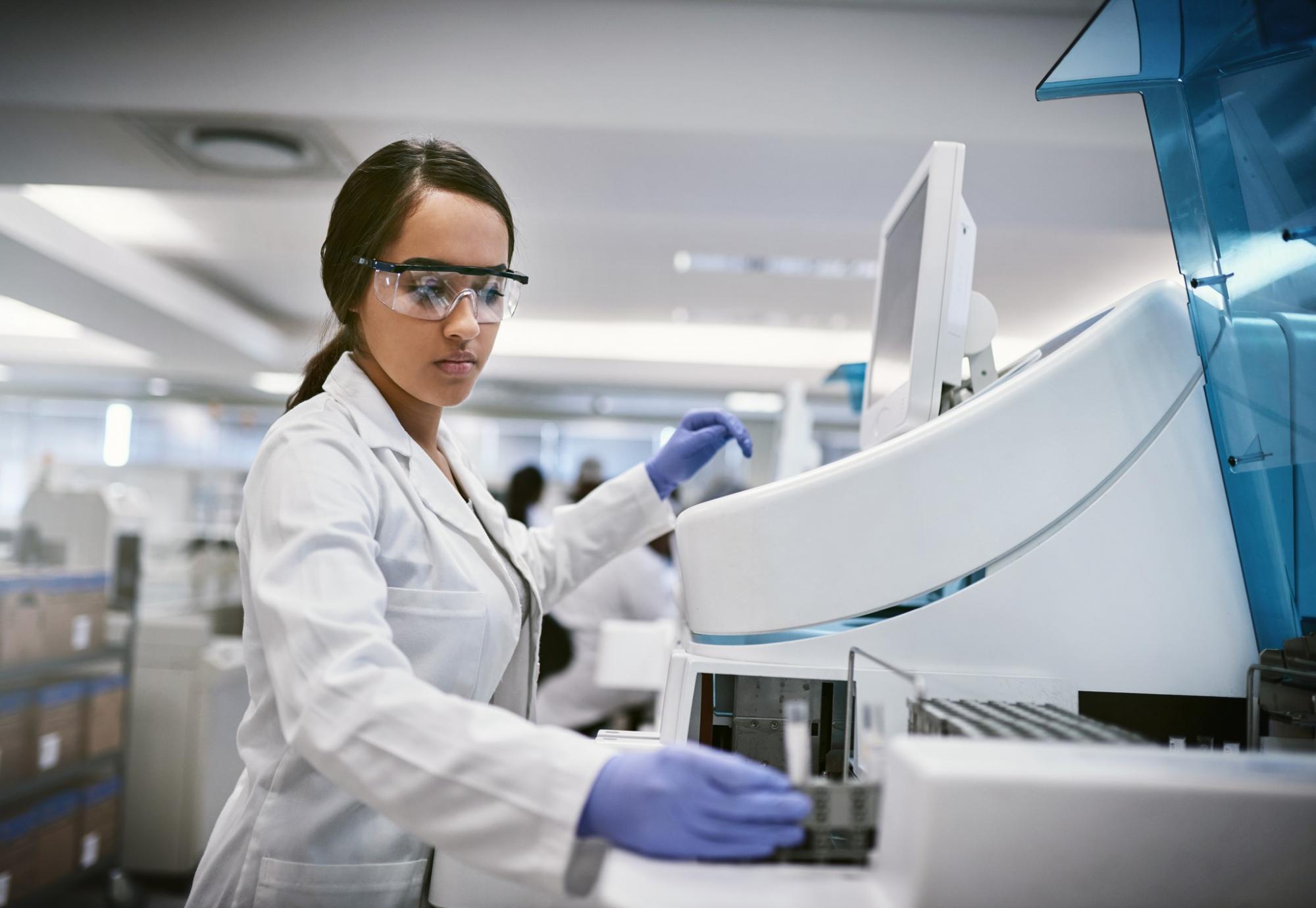 Female medical professional using diagnostic equipment