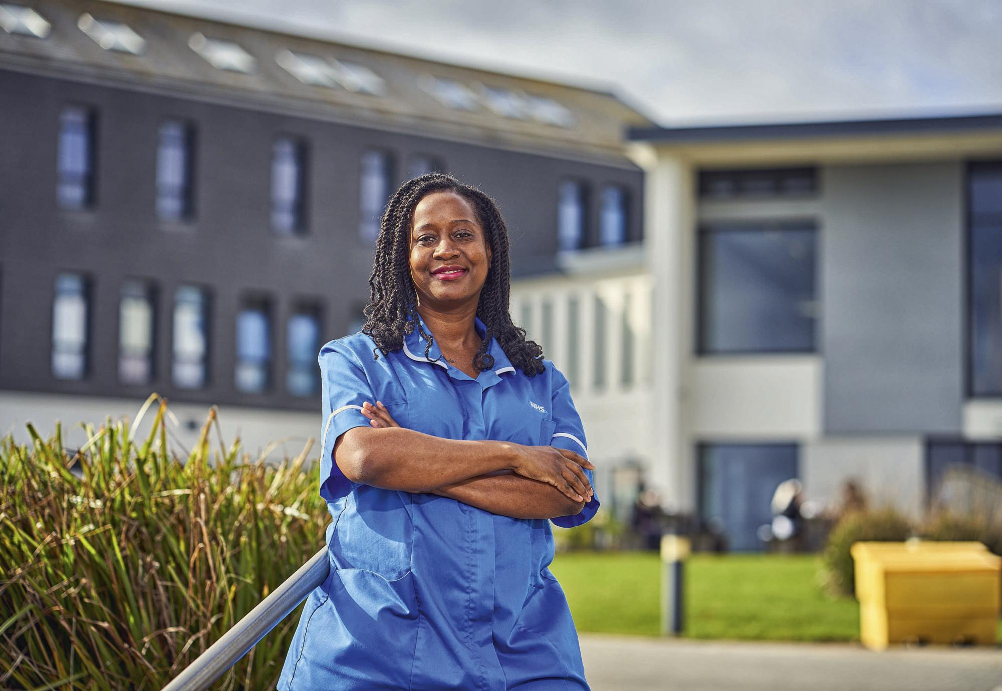 Nurse standing outside of a hospital