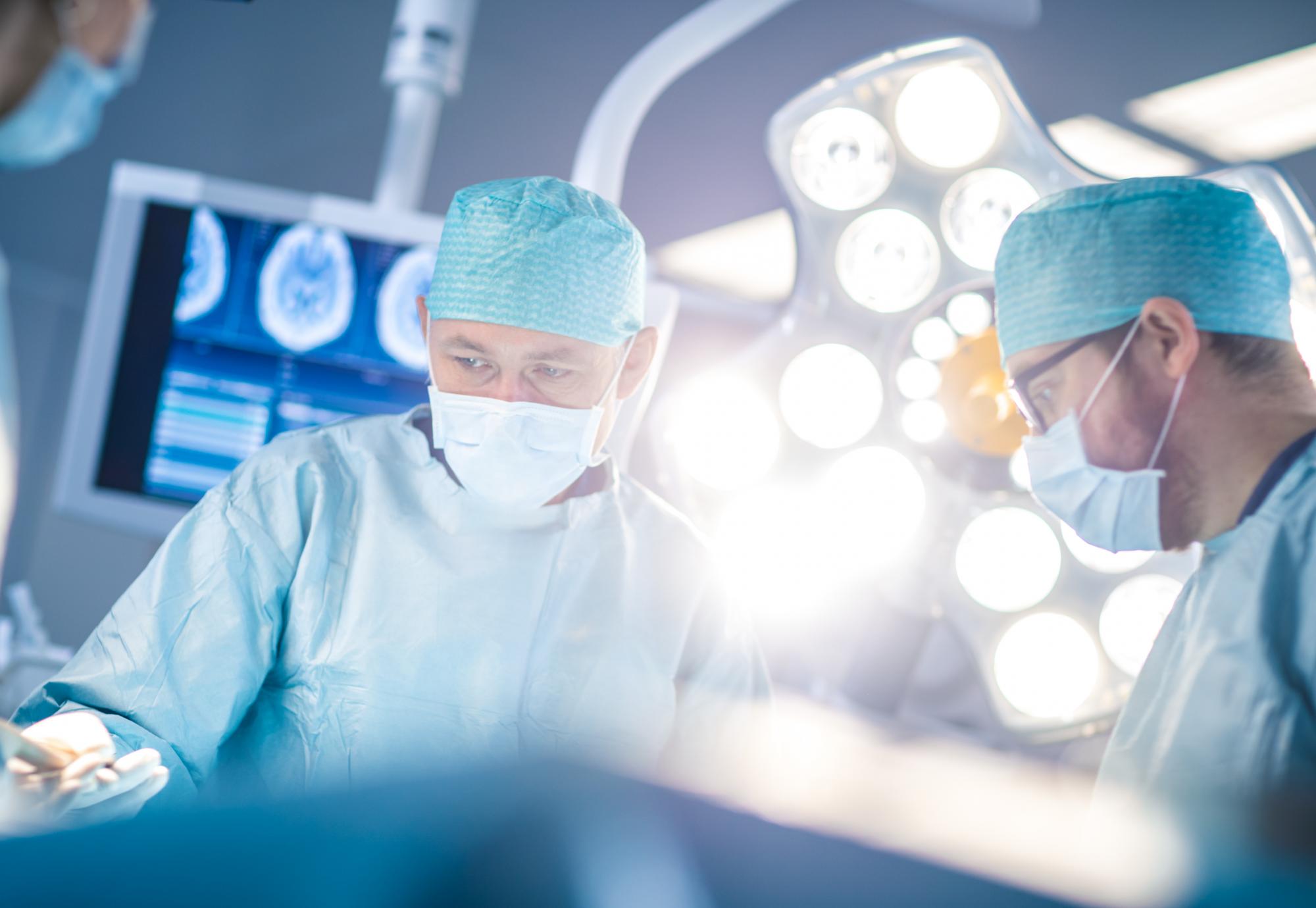 Surgeons working in an operating theatre