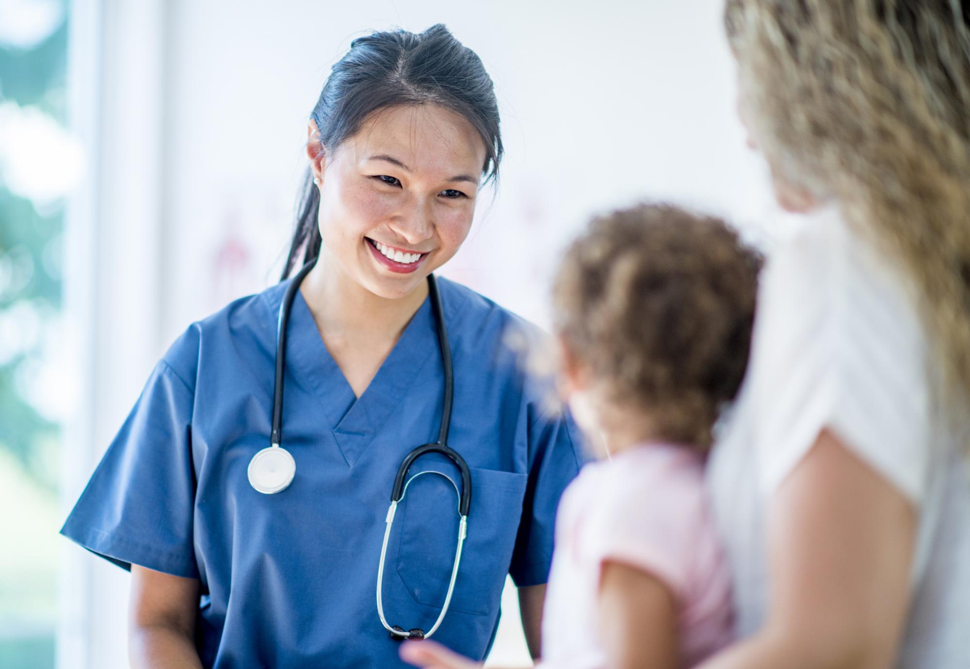 Female nurse seeing a young patient