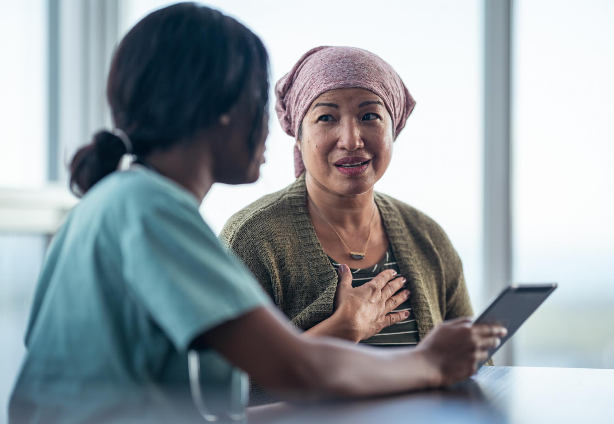 Woman in cancer meeting with a nurse