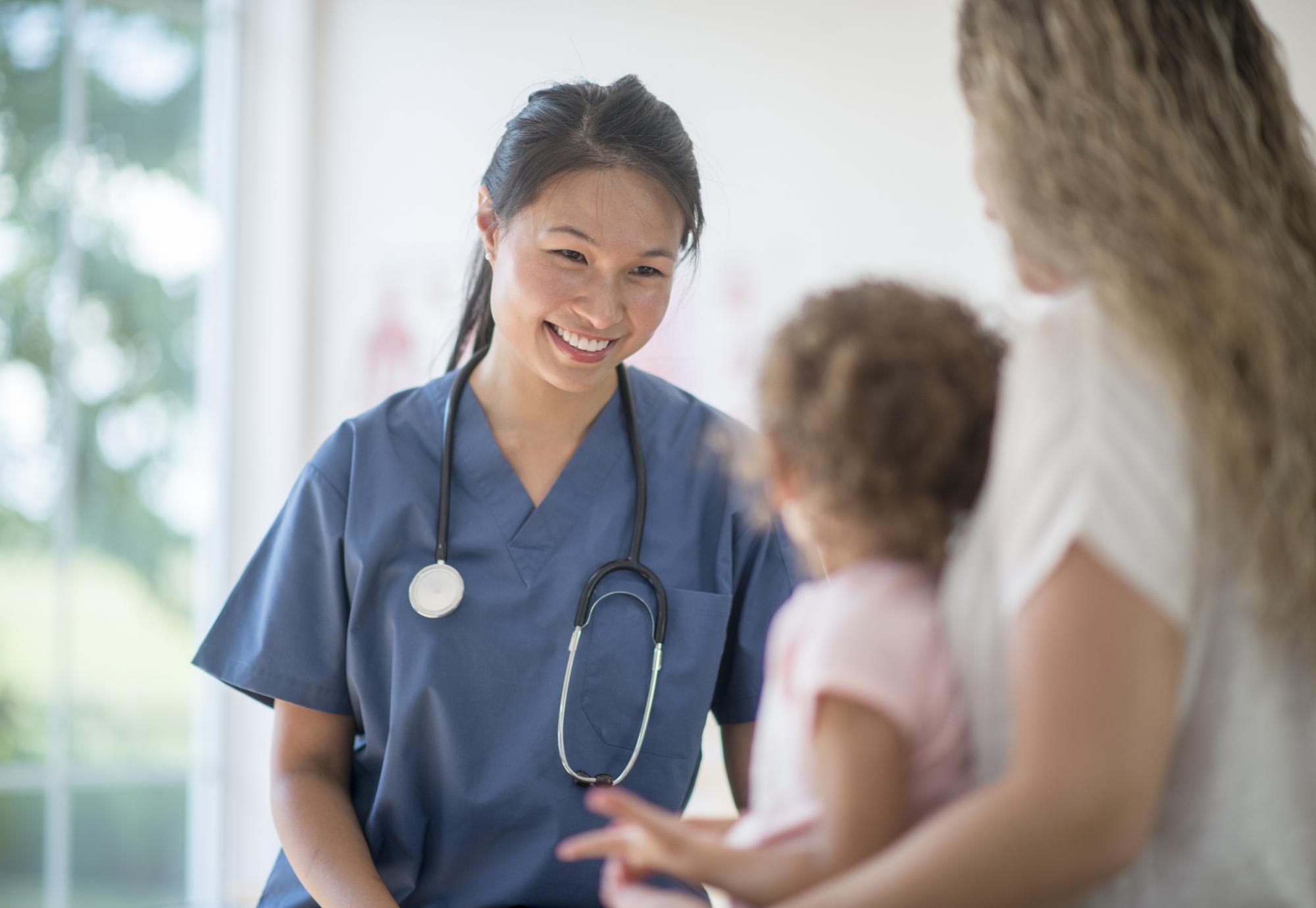 Female nurse with a young child