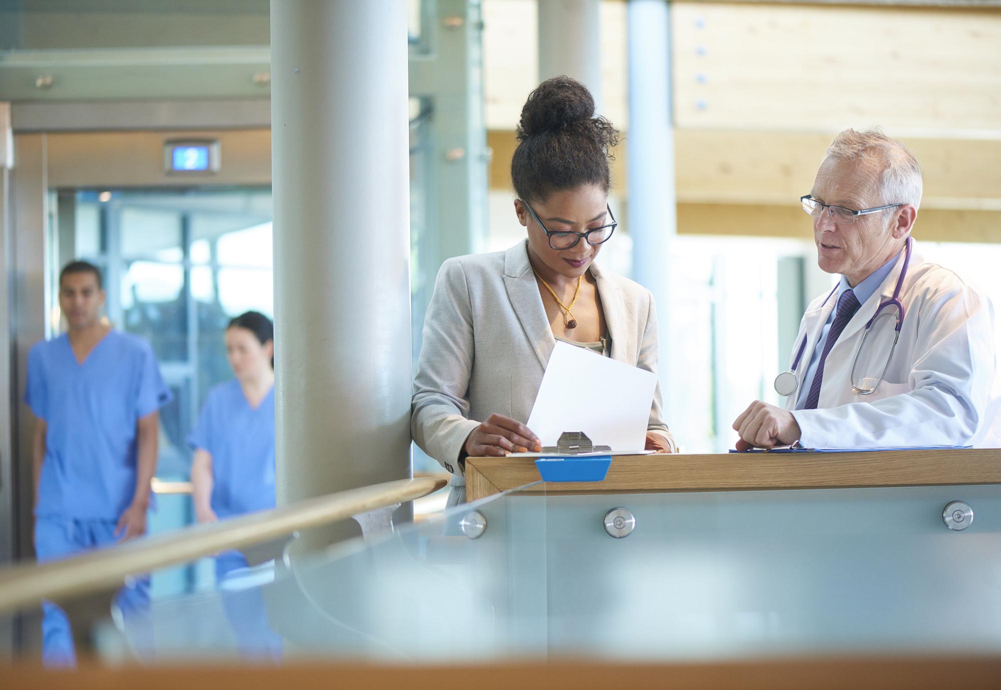 Medical colleagues discussing case data