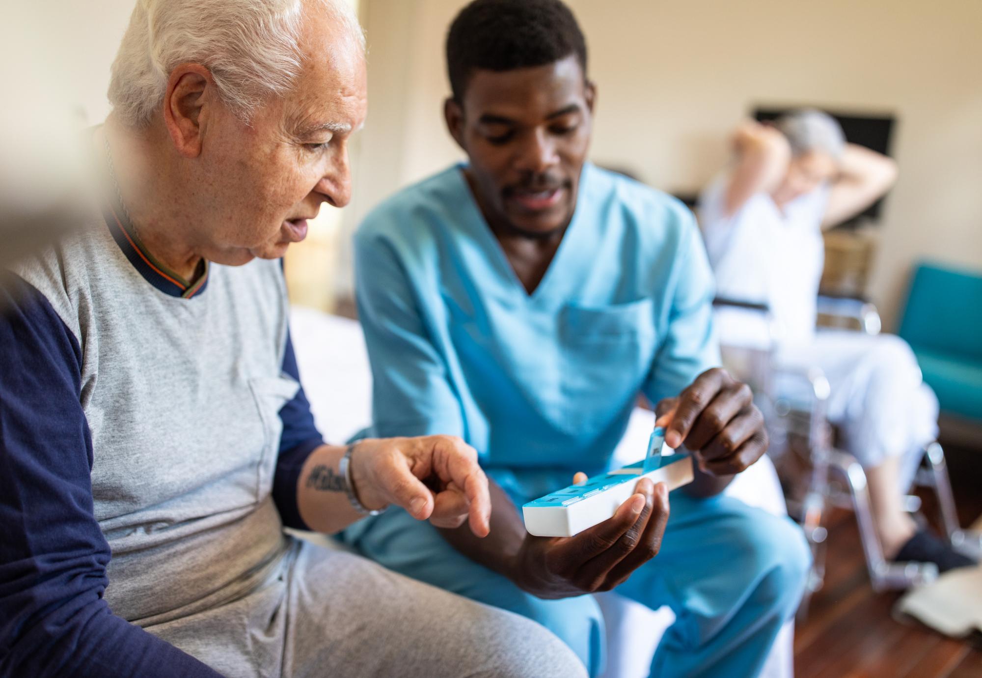 Young health worker helping a patient