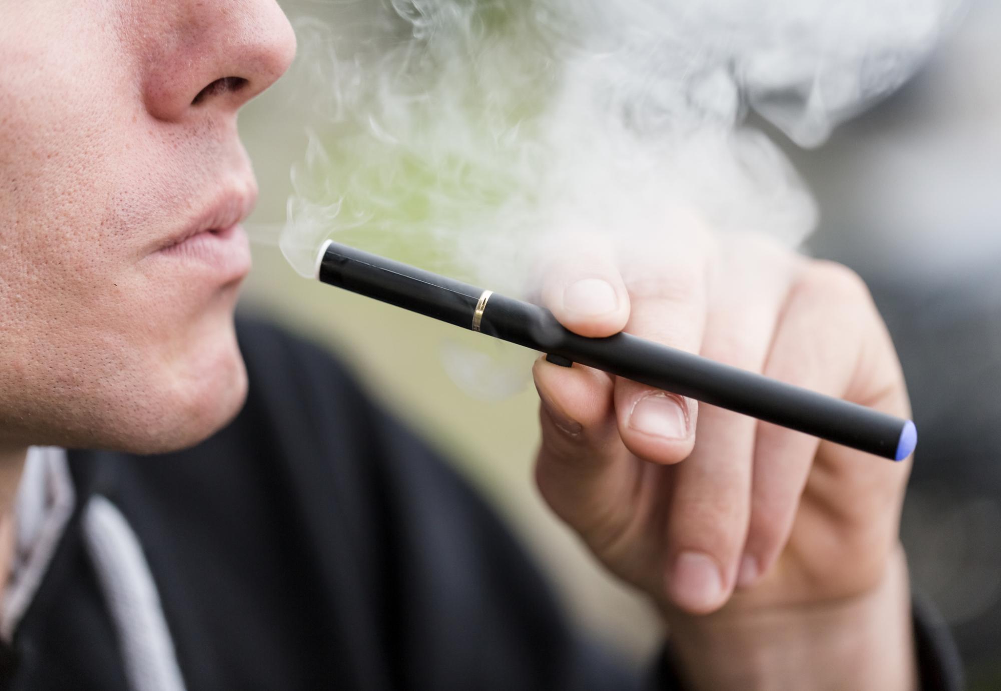 man using e-cigarette 