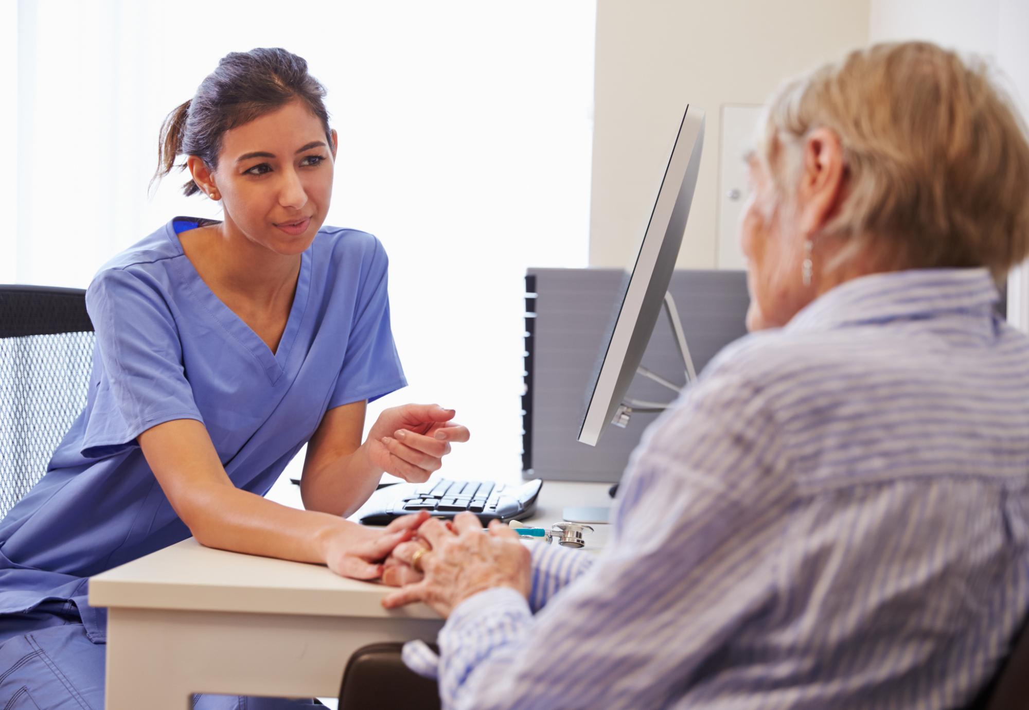 Nurse carrying out a consultation with a patient