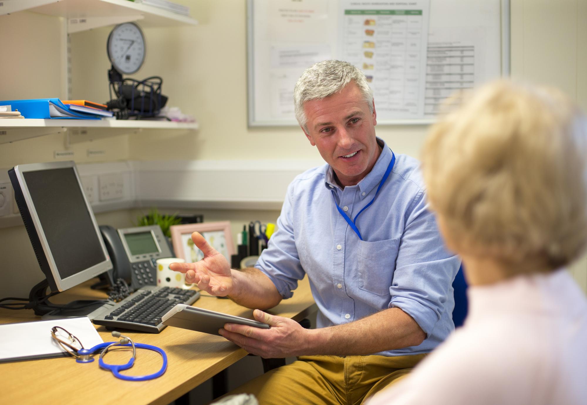 GP speaking with a patient during an appointment