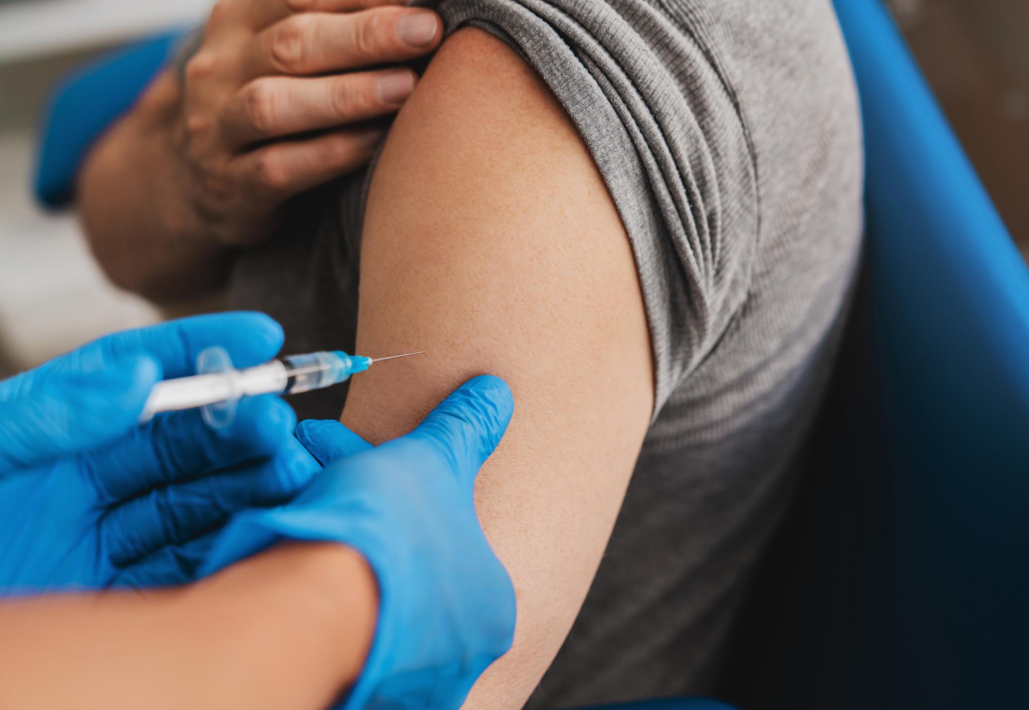 Vaccine being administered into a patient's arm