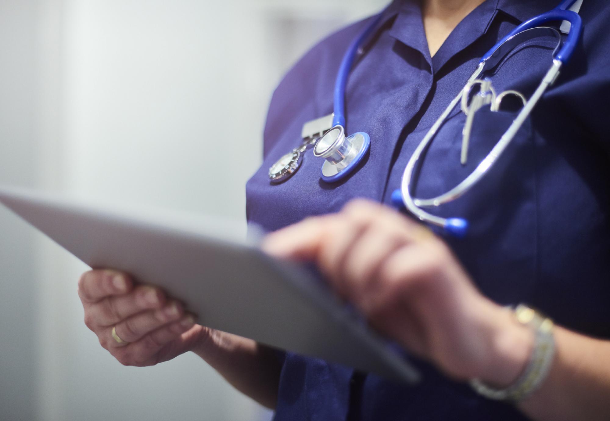 nurse using tablet