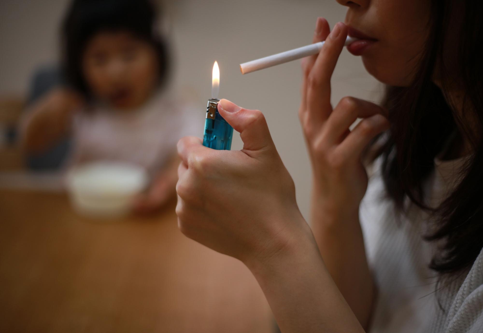 adult smoking near child 