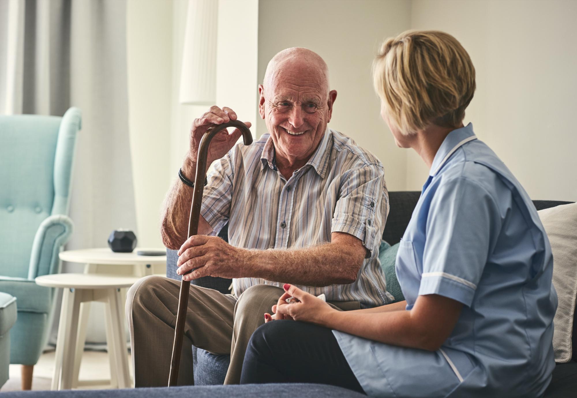 Community nurse talking with an elderly resident