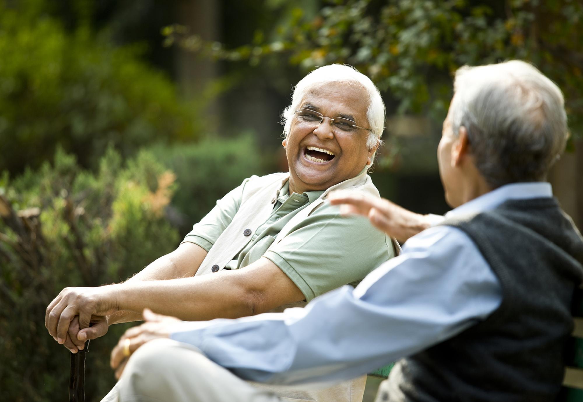 two elderly men laughing