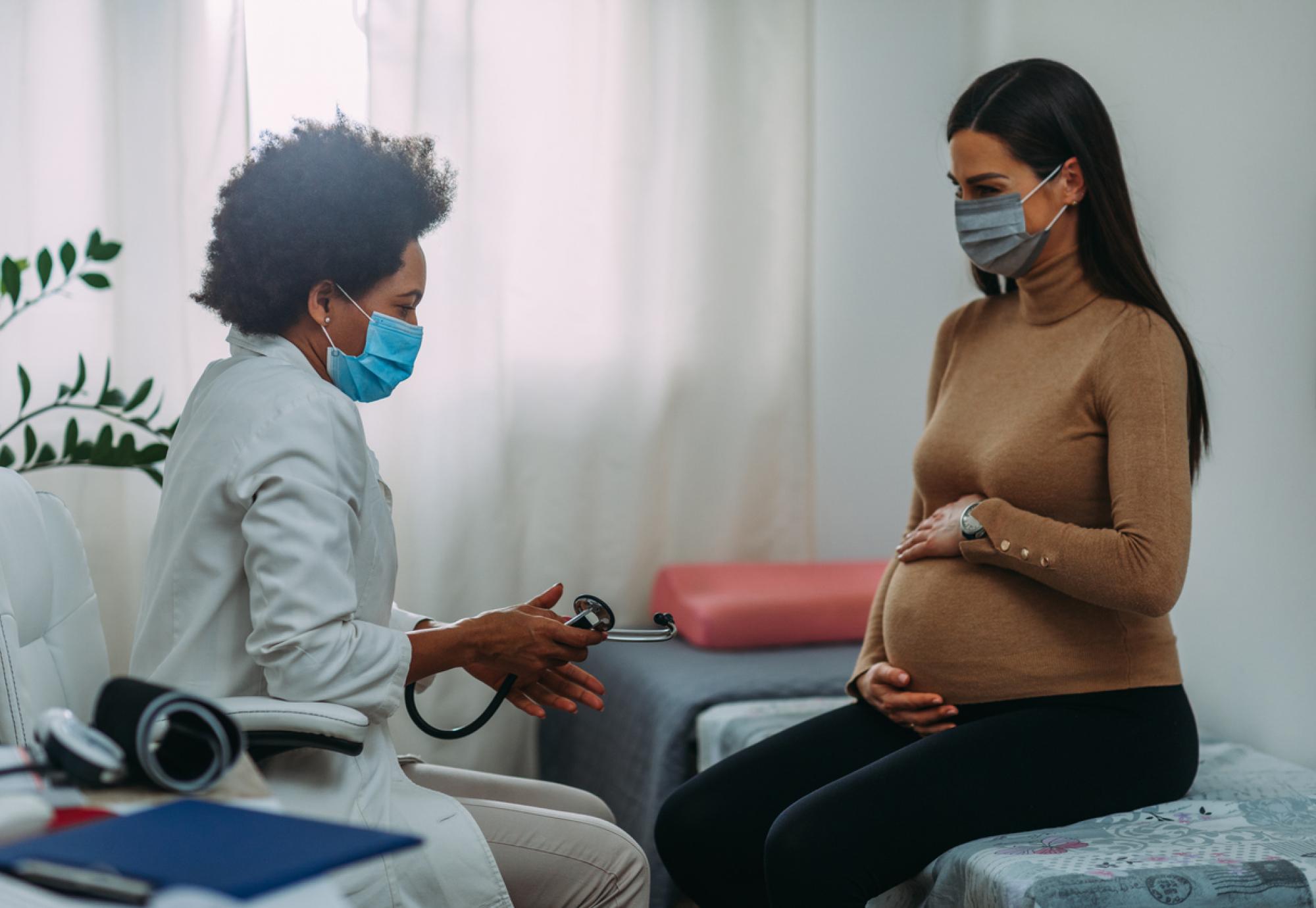 pregnant woman with doctor