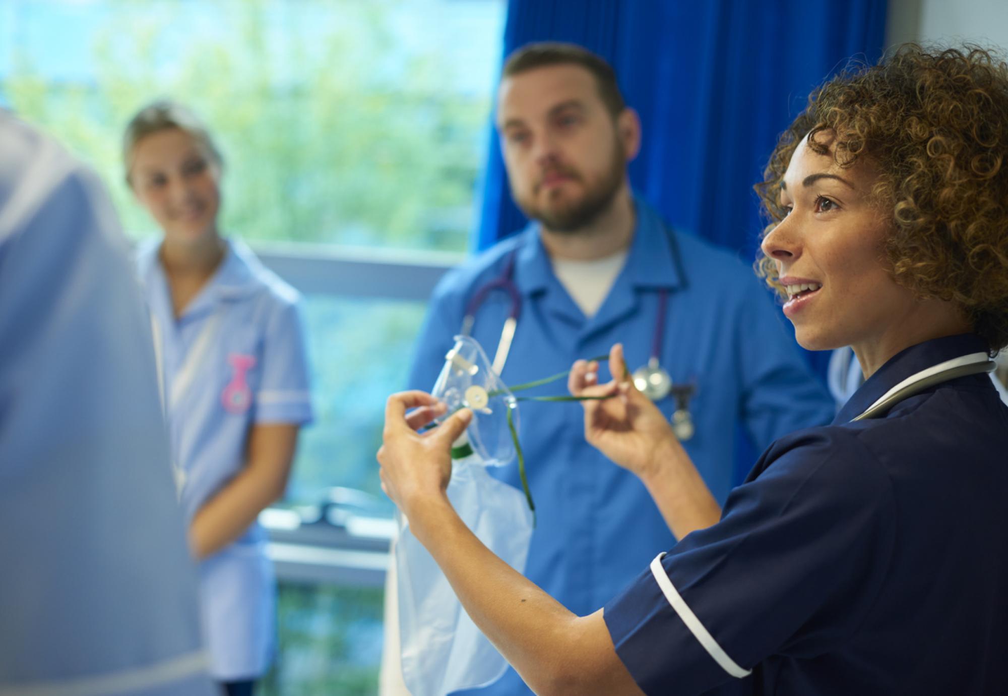 nhs nurse giving training 