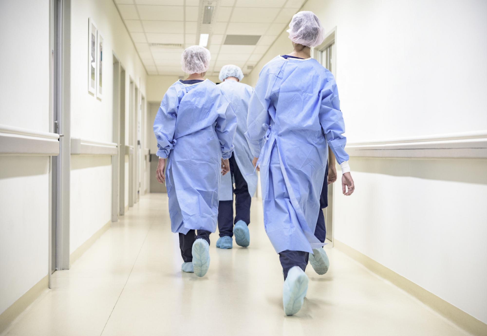 Medical staff walking through the corridor 