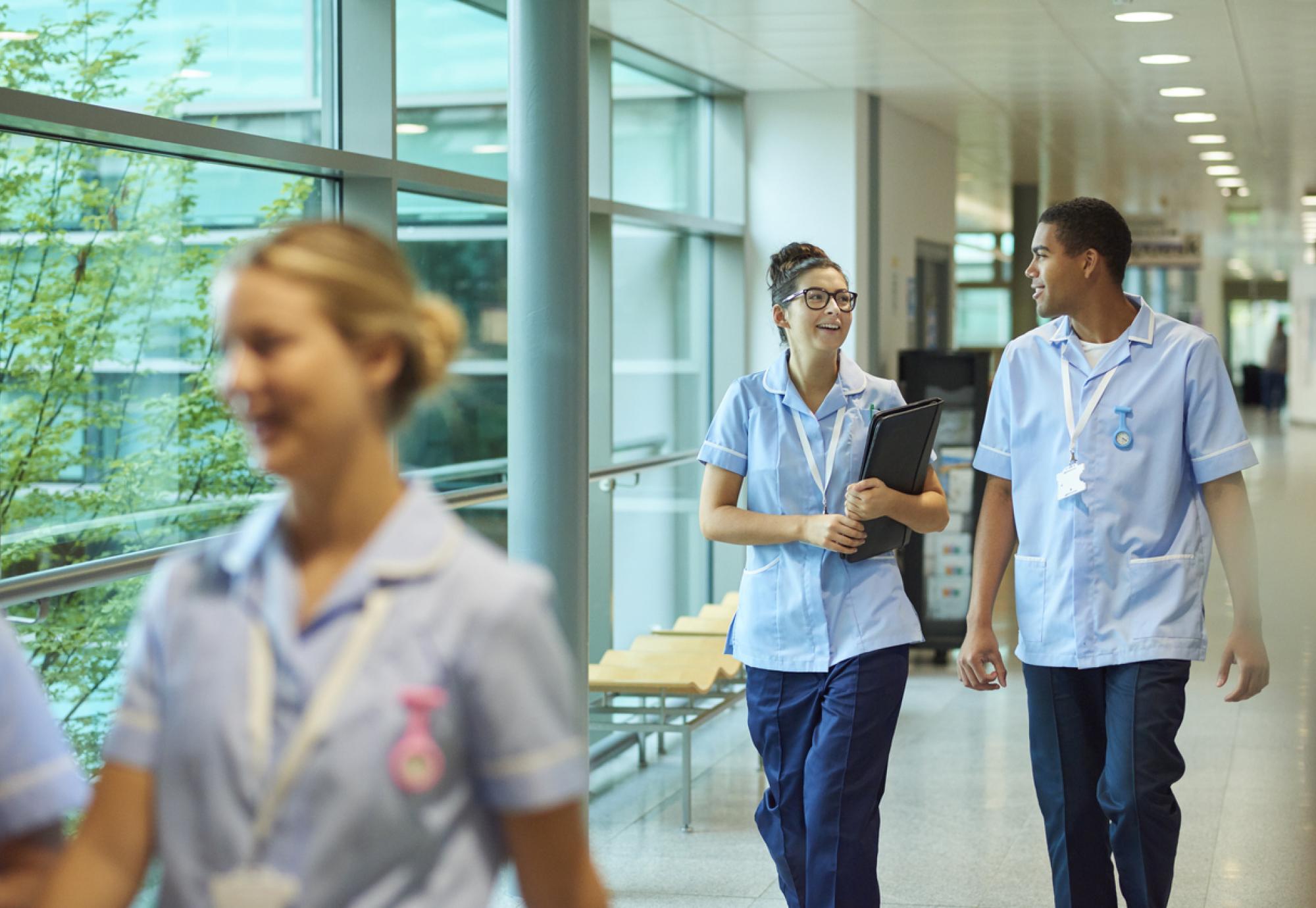 Nurses walking through corridor