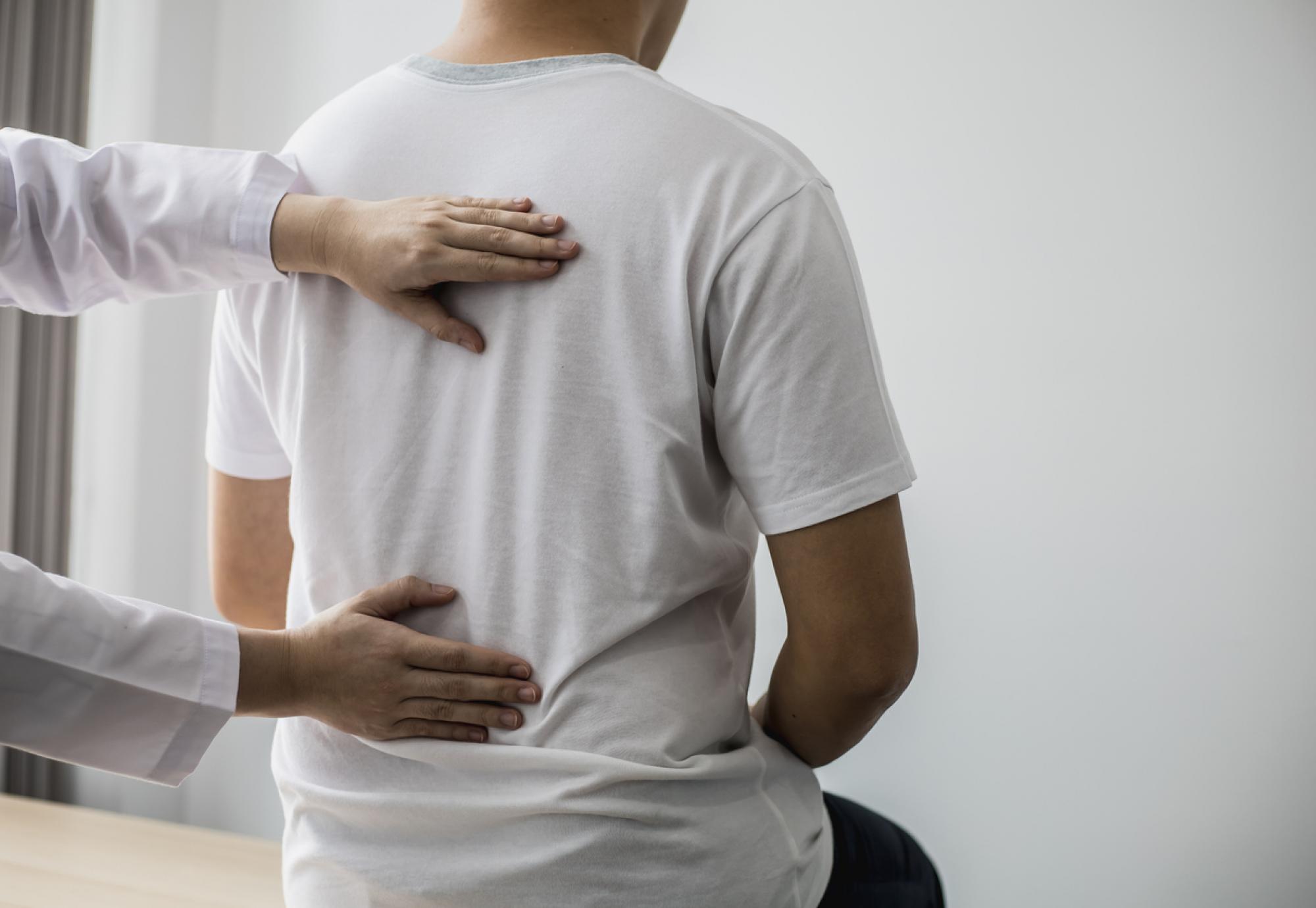 chiropractor with patient