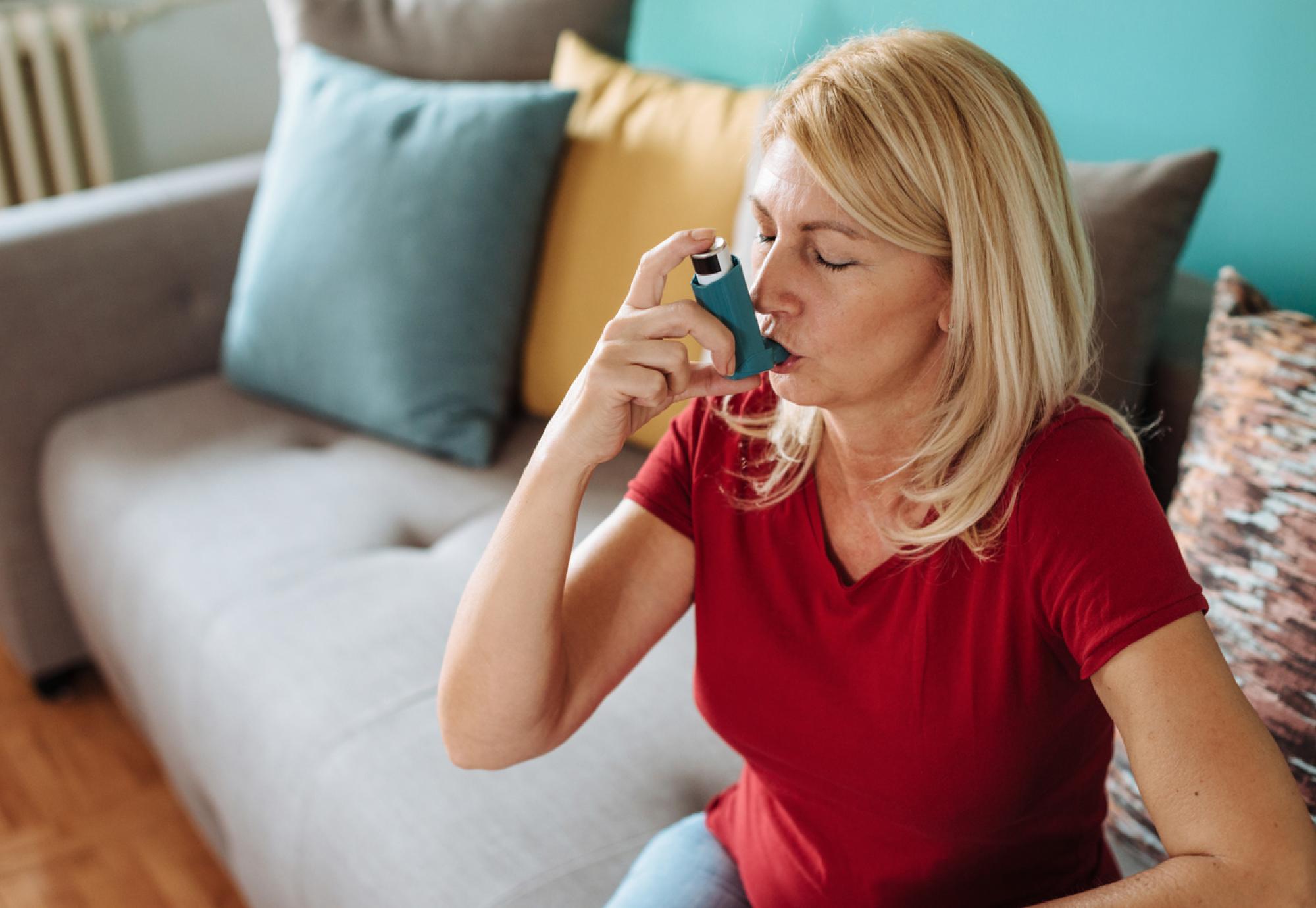 Woman using inhaler