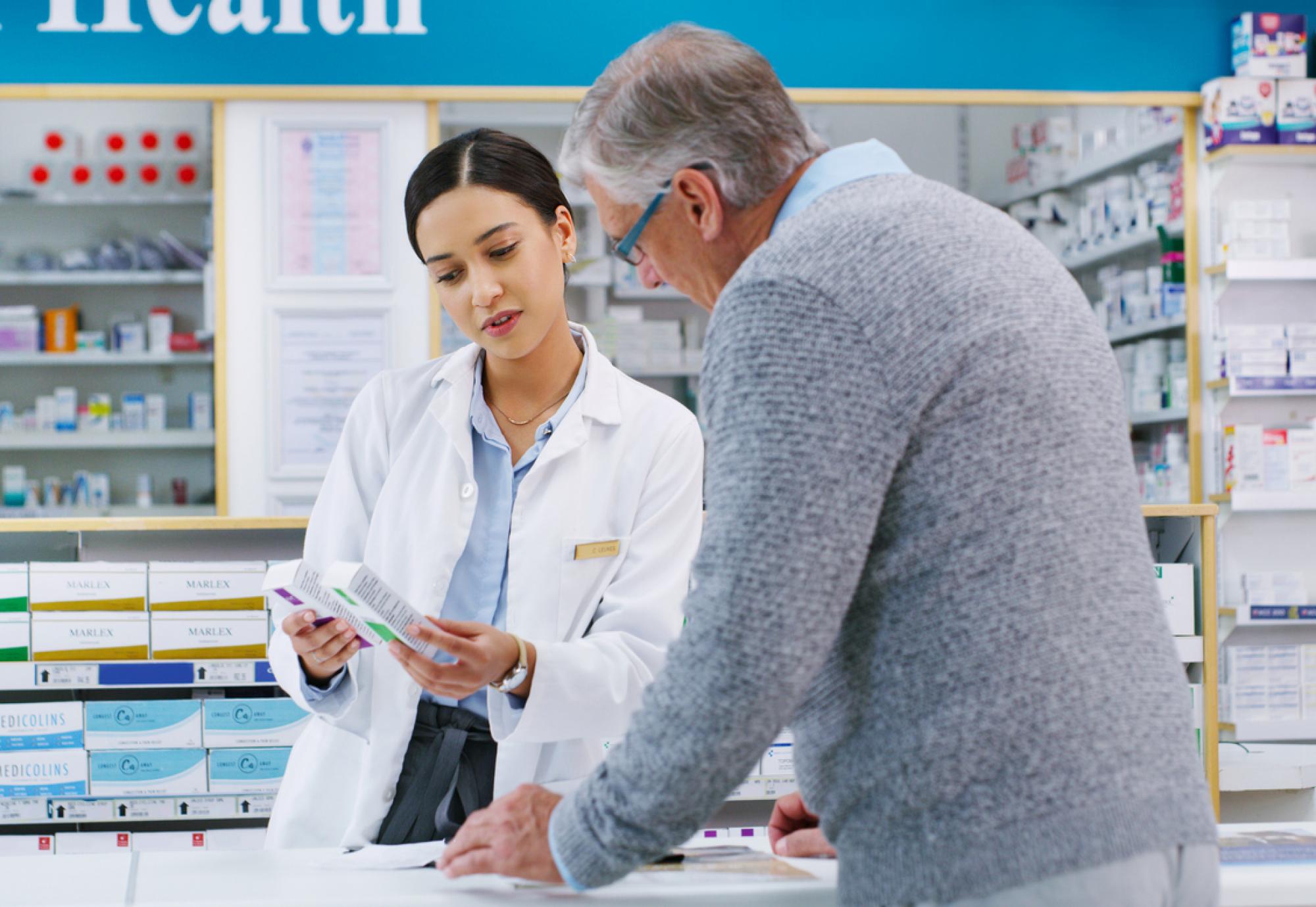 Pharmacist helping man