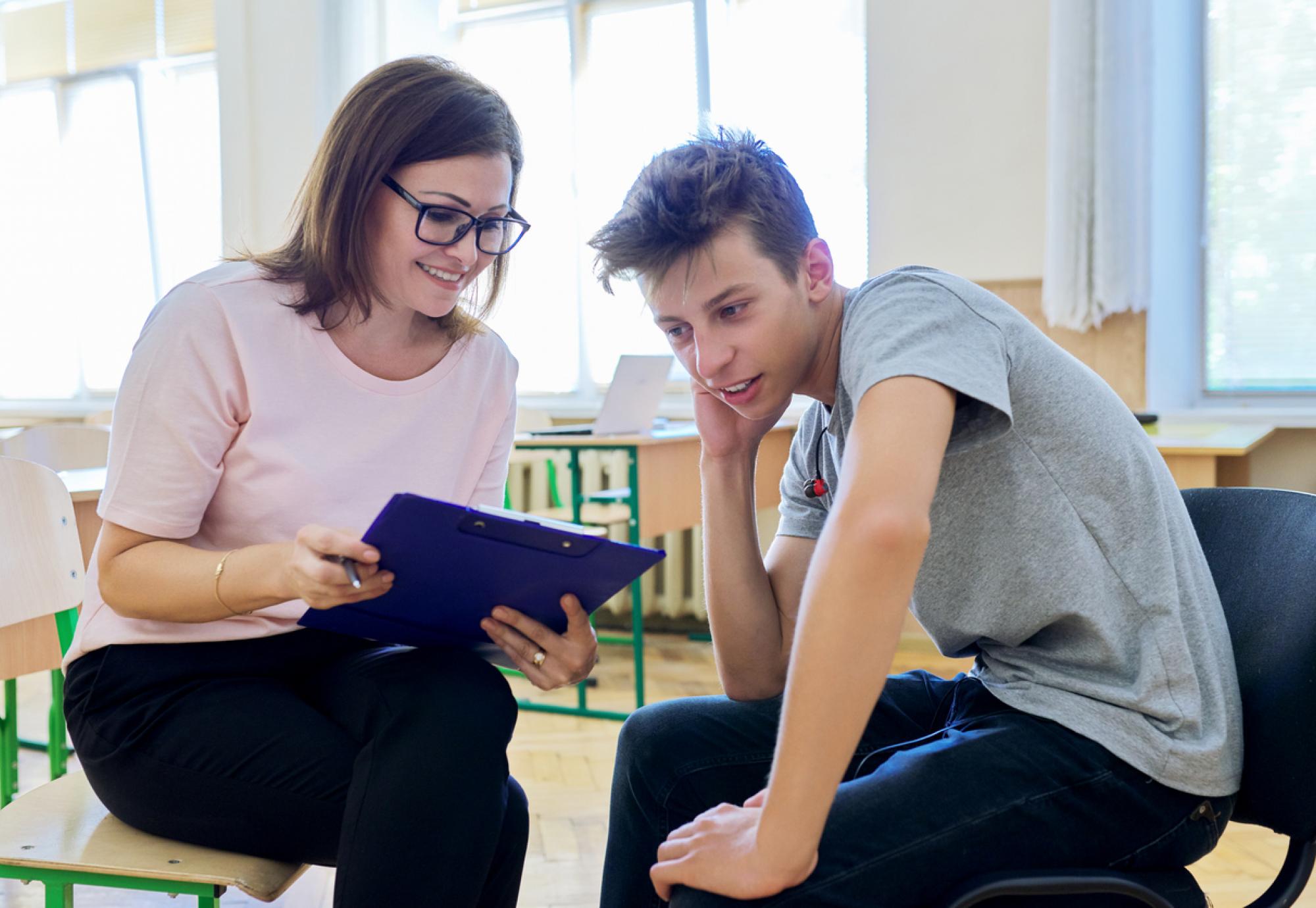 Woman helping student 