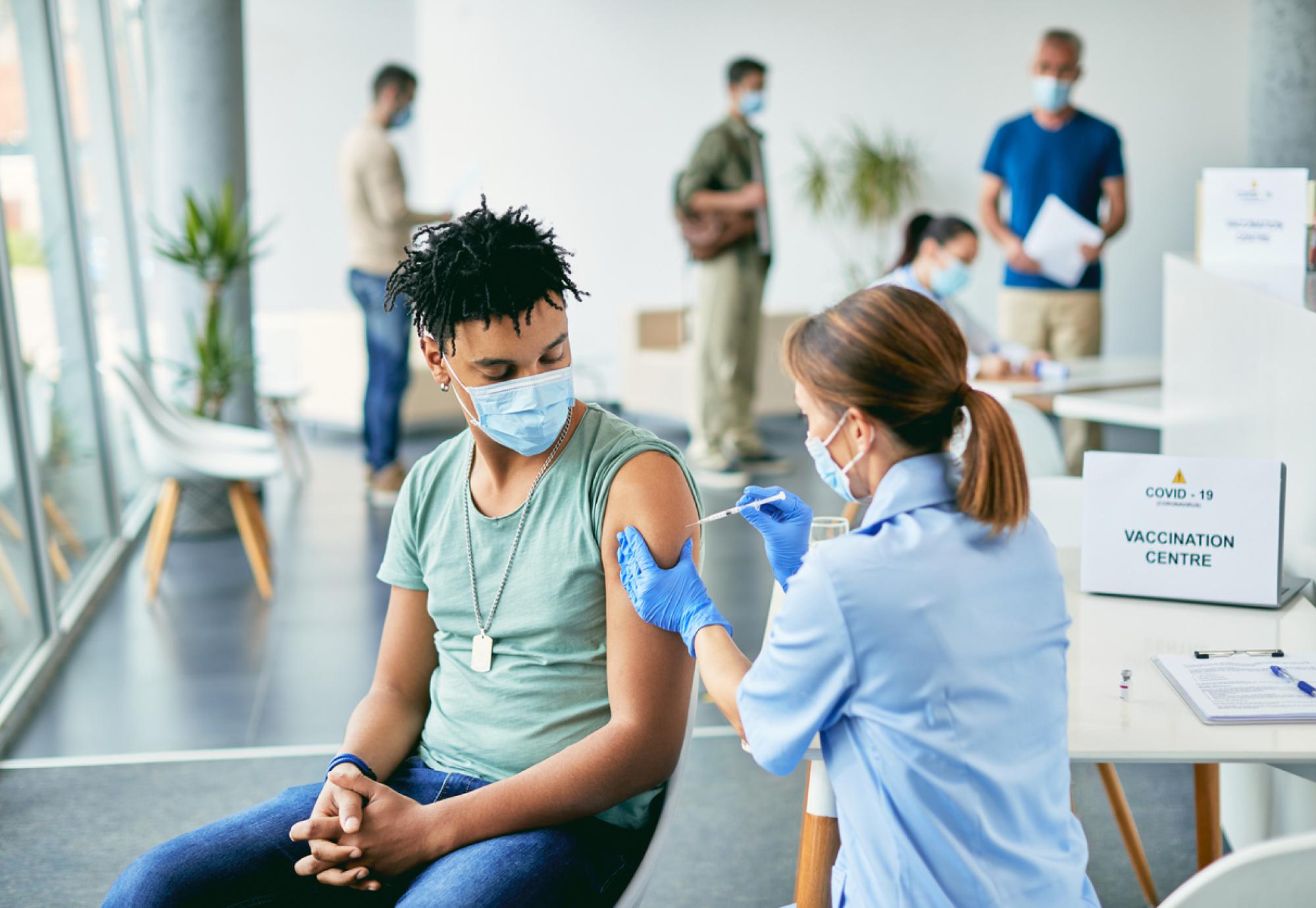 Doctor administering vaccine