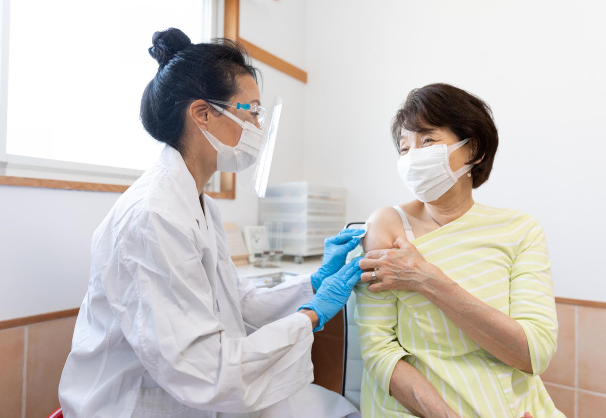 Doctor administering vaccine