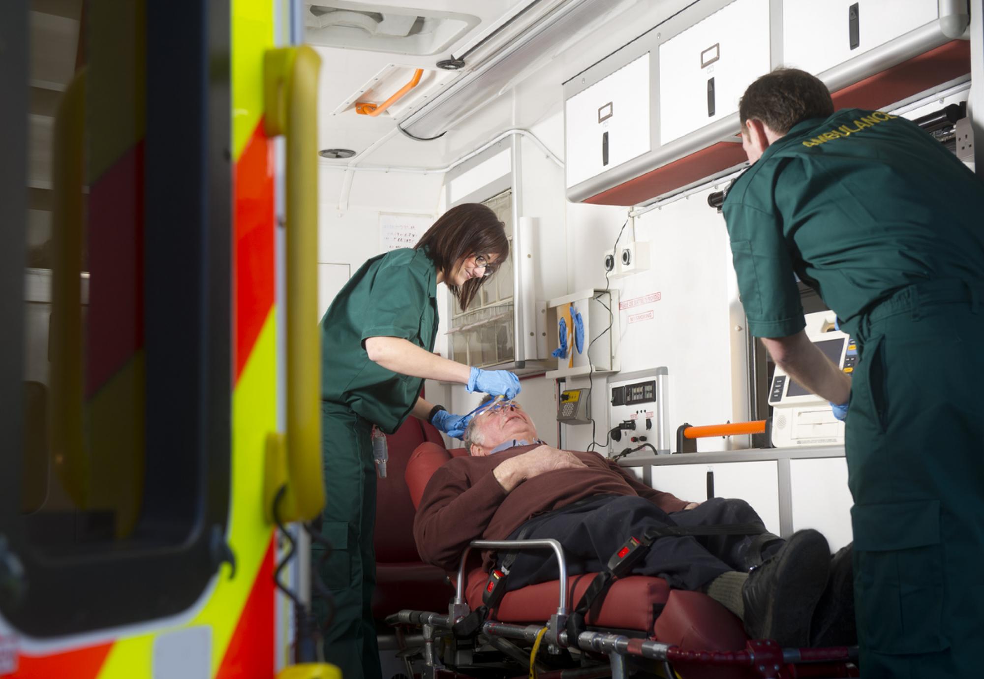 Emergency services attending to man