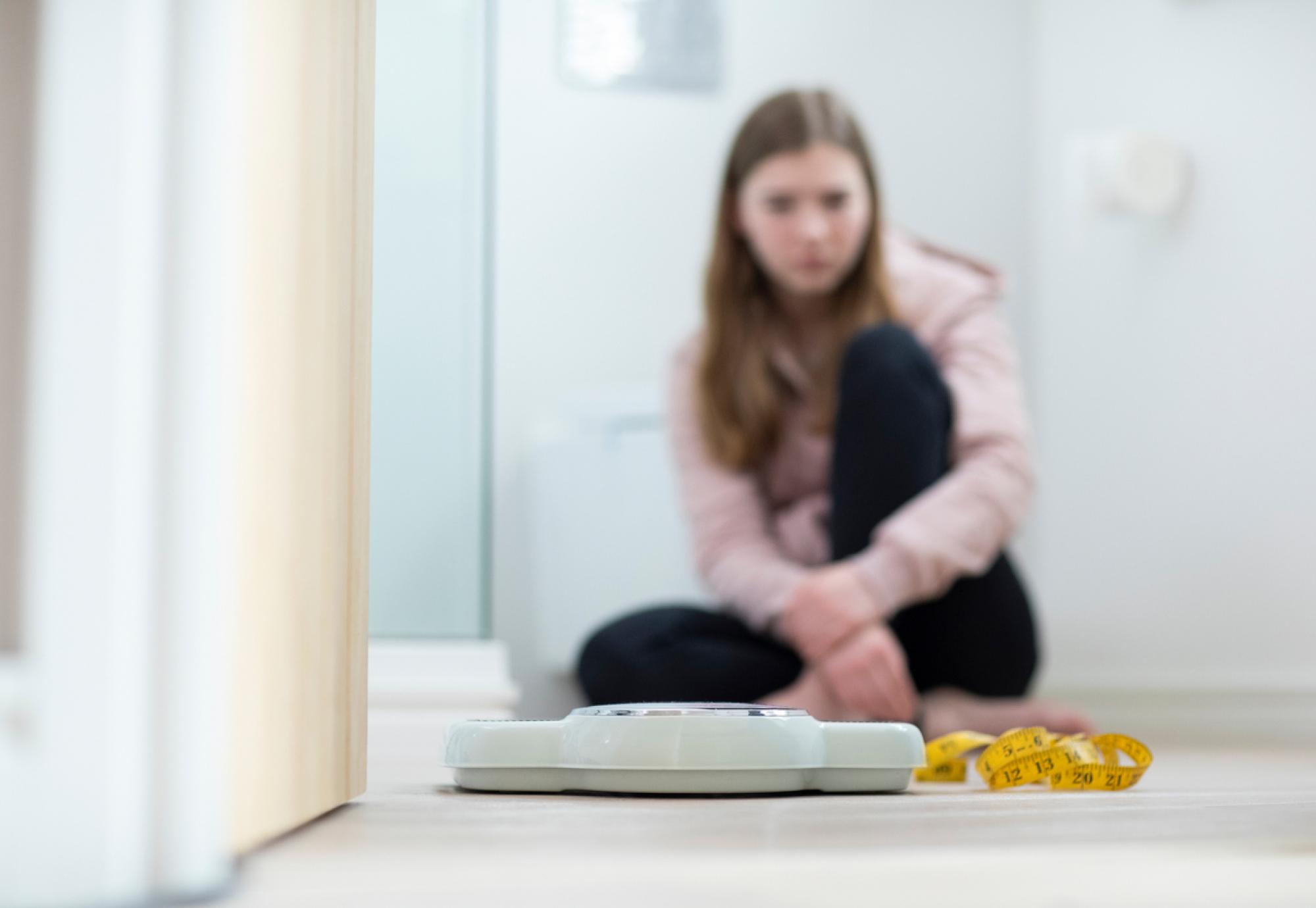 Girl looking at scales 