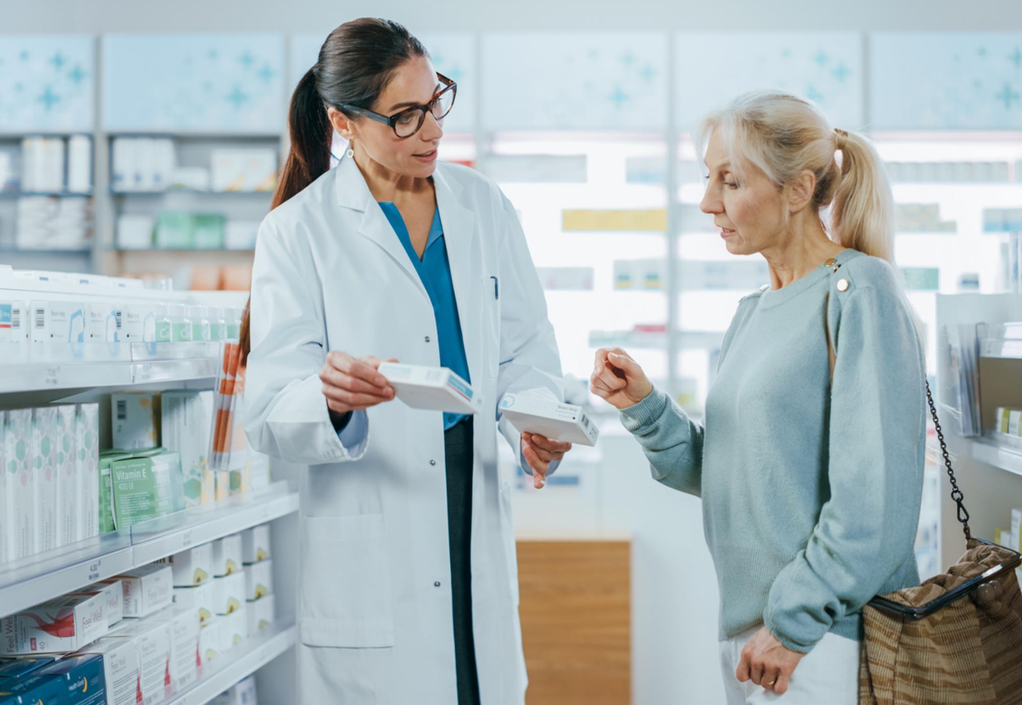 Pharmacist helping woman