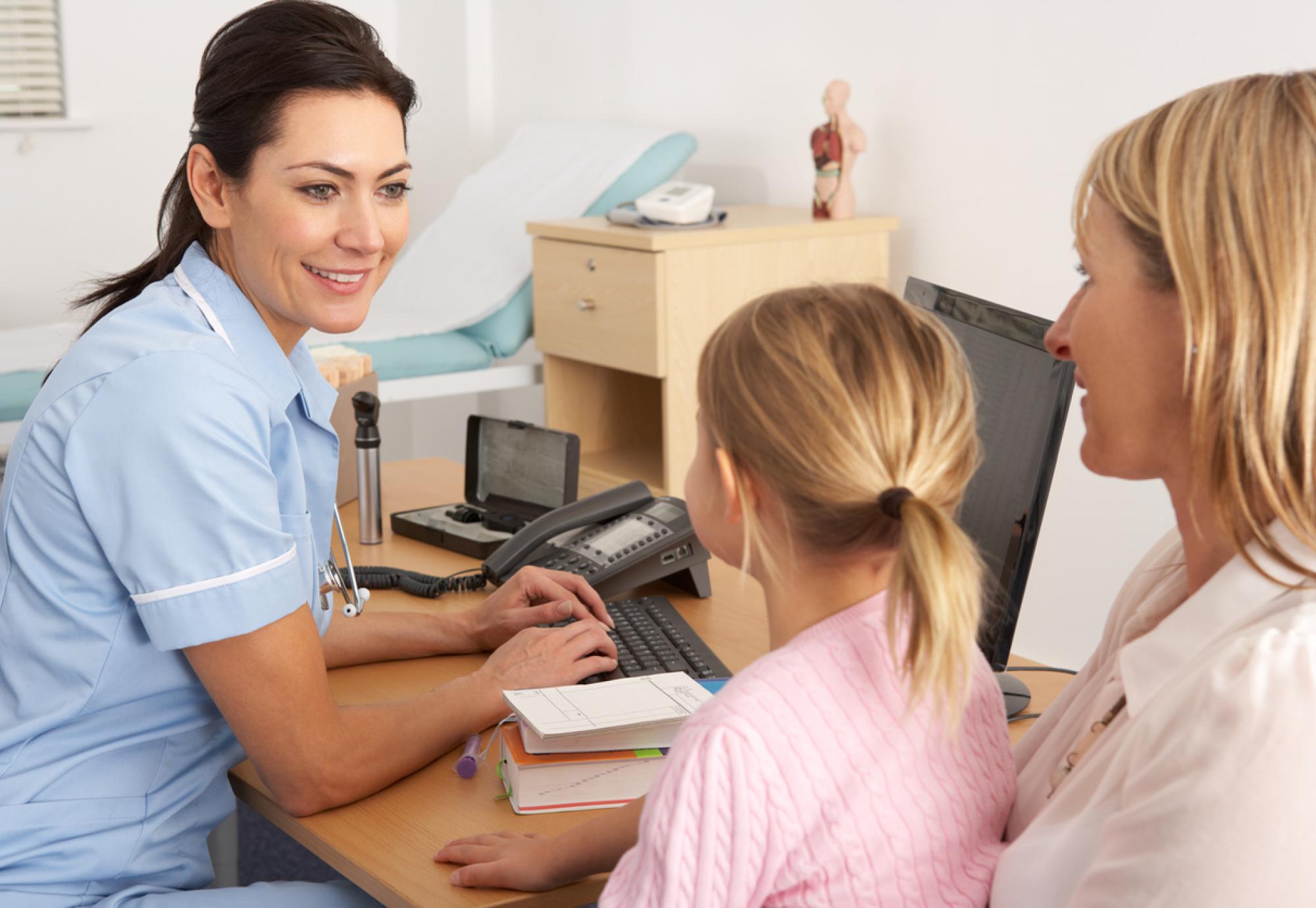 Nurse with mother and child