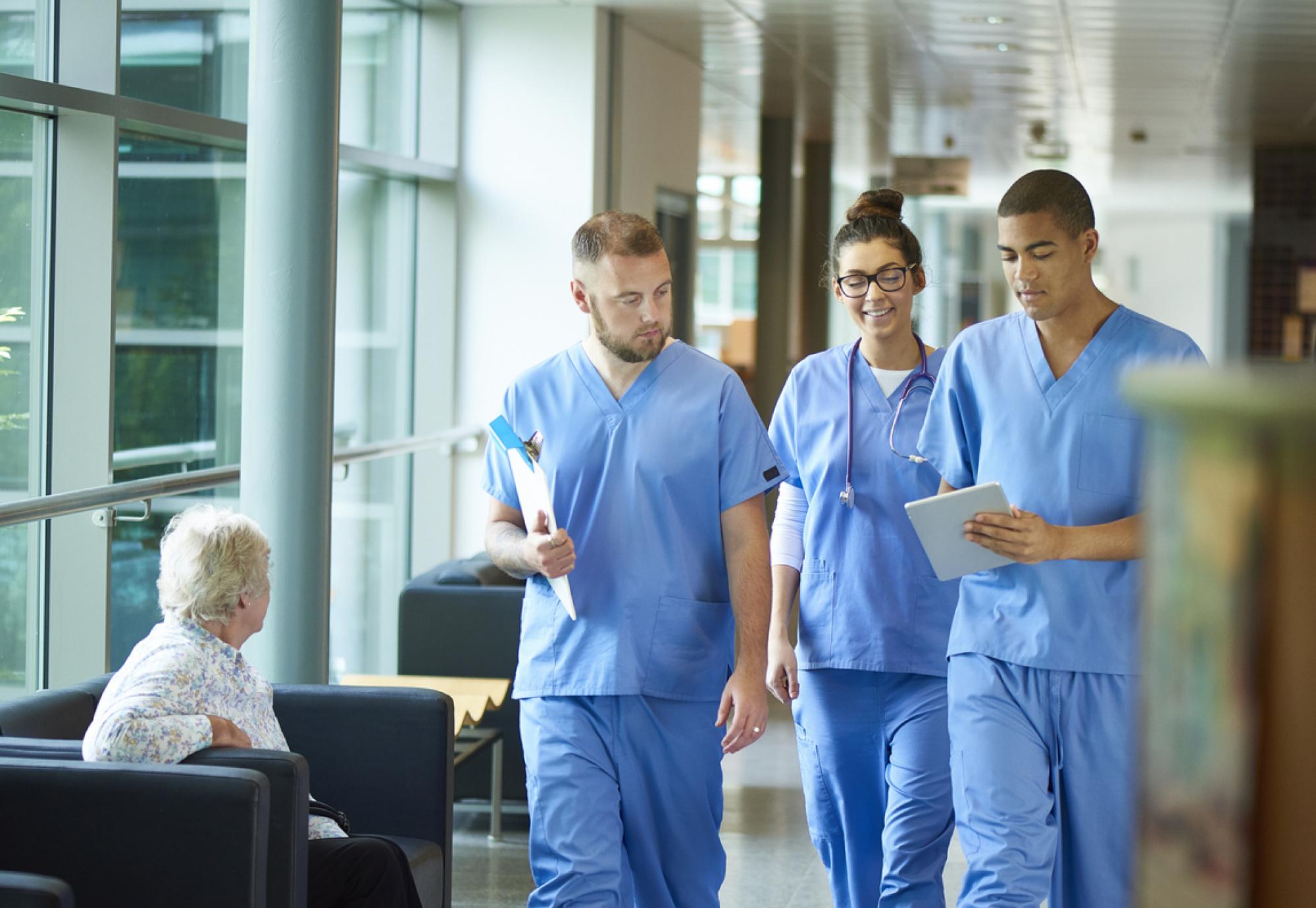 Nurses walking through corridor