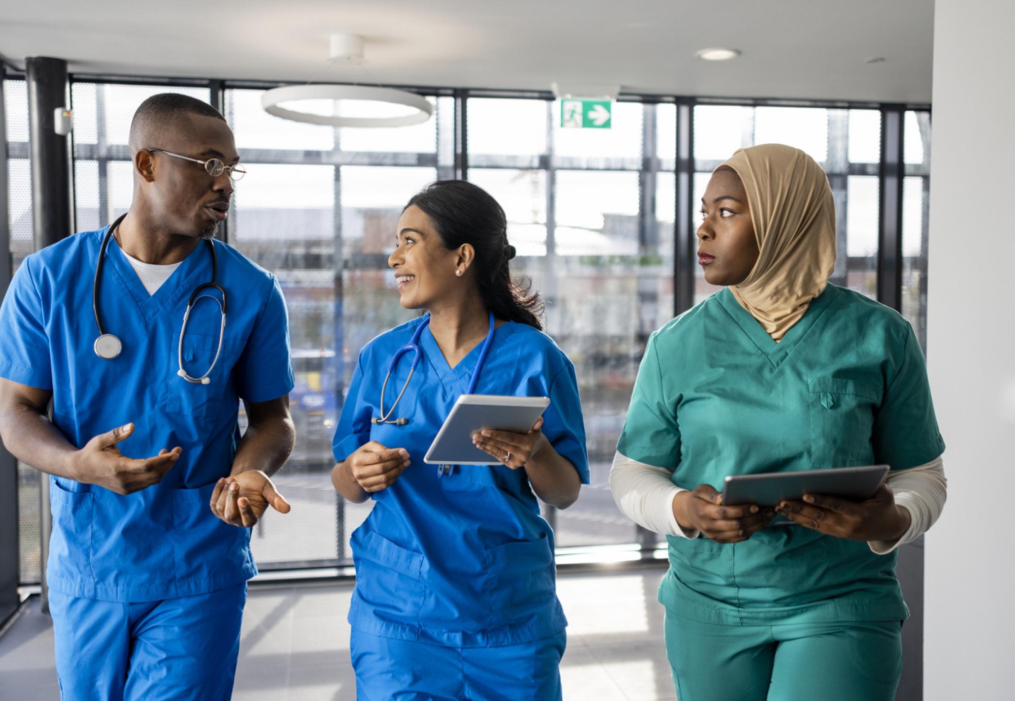 Medical staff walking through a corridor 