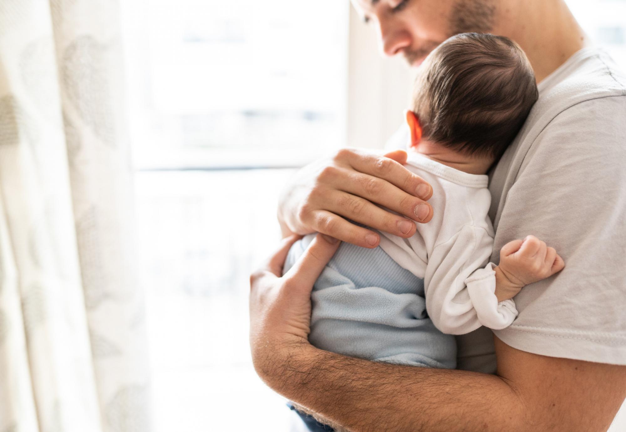 Dad holding baby