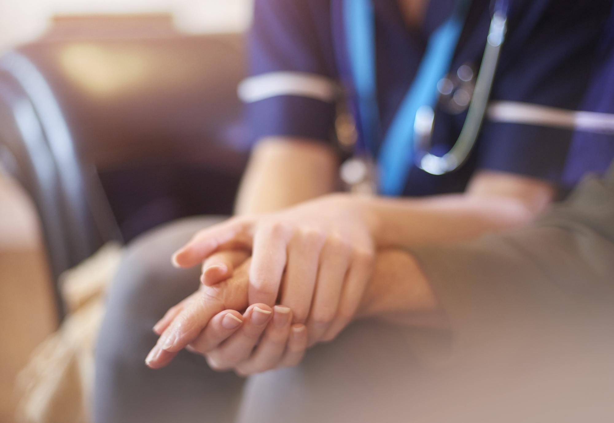 Nurse consoling patient